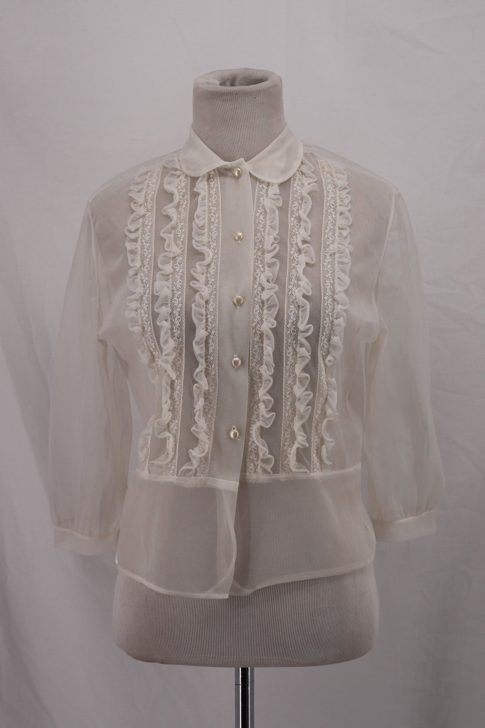 Vintage 1950's White Nylon Blouse with Lace: white nylon, 3/4 sleeves, high round collar, button front, horizontal lace and ruffled tim, approx. 36 bust, 32 waist, some small holes see photo's
