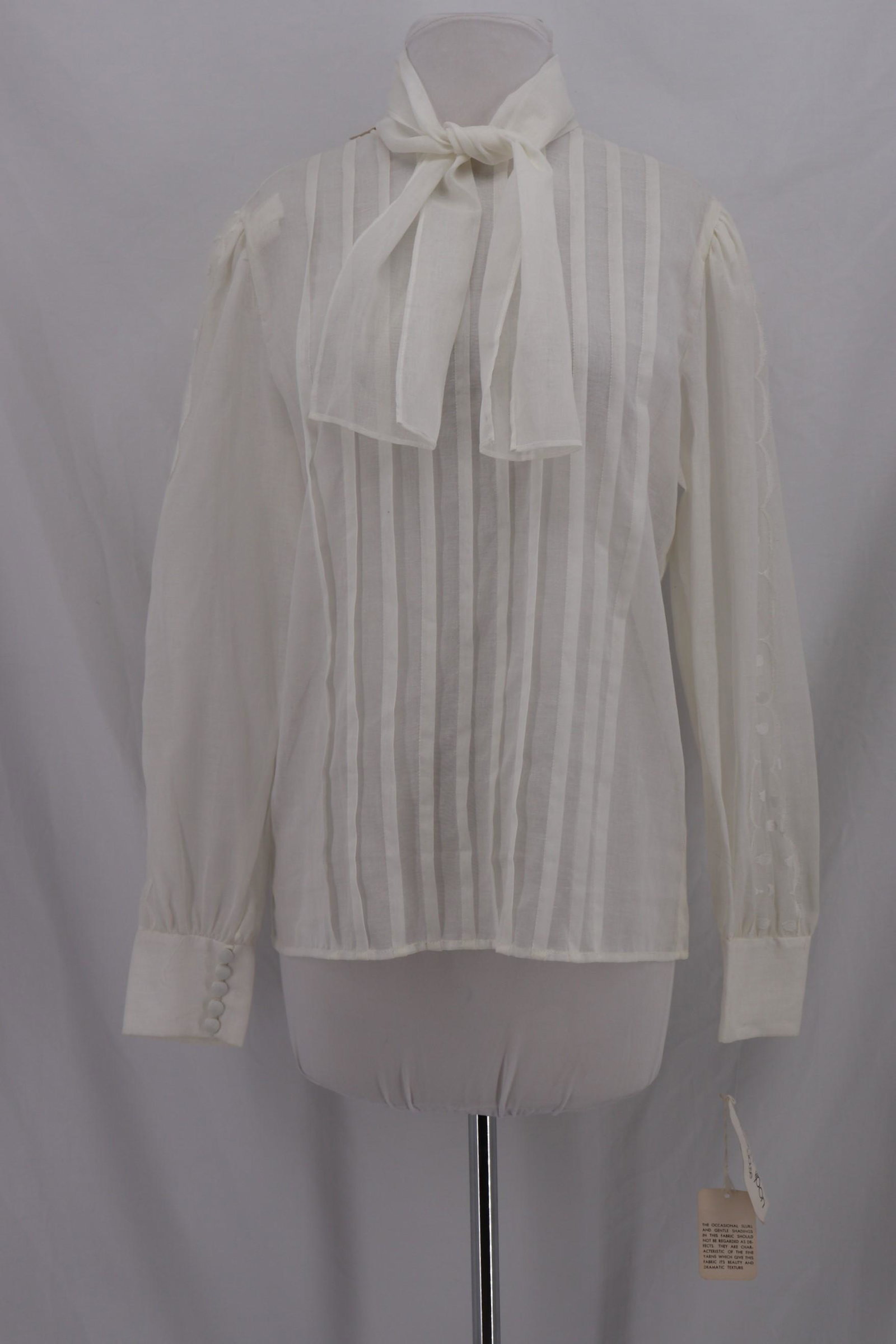 Vintage 1970's ALBERT NIPPON White Cotton & Lace Blouse: Long sleeves , button cuffs, long neck, comes with tie, vertical pleated front, one button in loop back, new with tags, Approx.; 40 bust, 38 waist