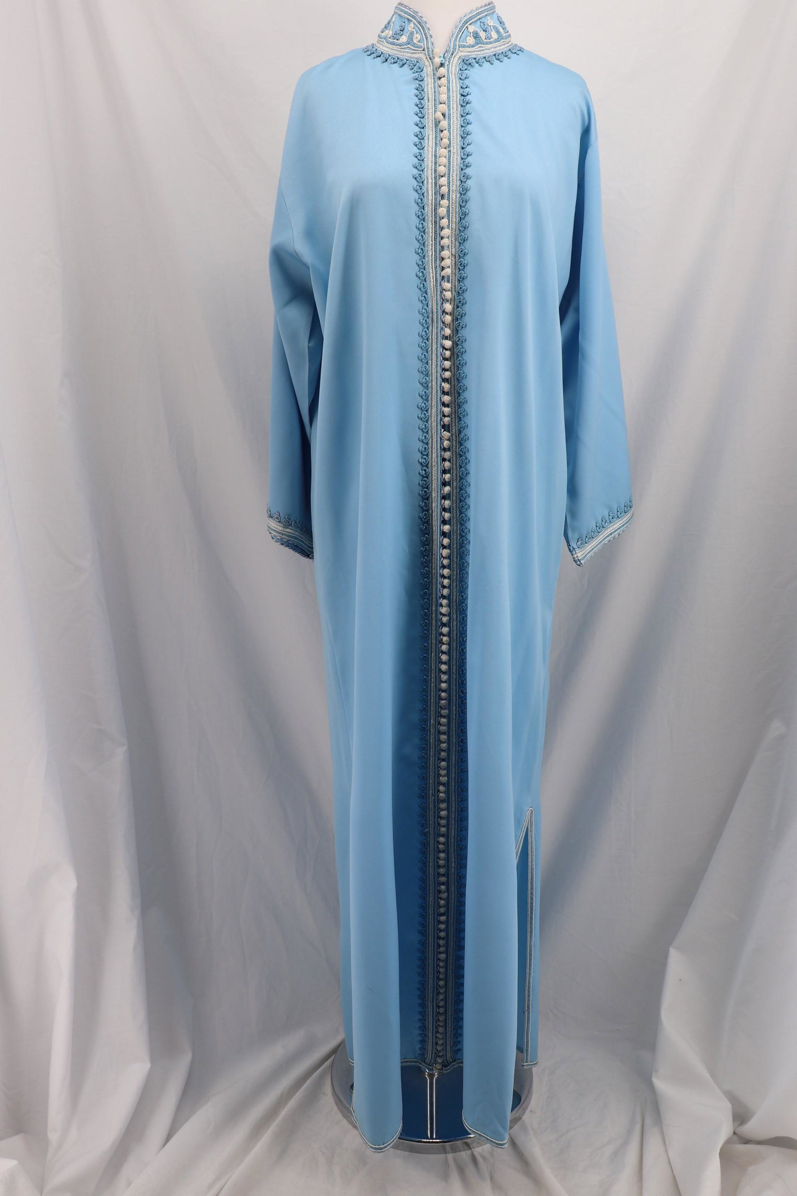 Vintage 1980's FAKHITA SEBTI Caftan: Long wide sleeves with decorative chord trim, high collar with hidden zipper front, loop and button front with decorative chord design Polly blend fabric, Approx.; 44 bust 46 waist.