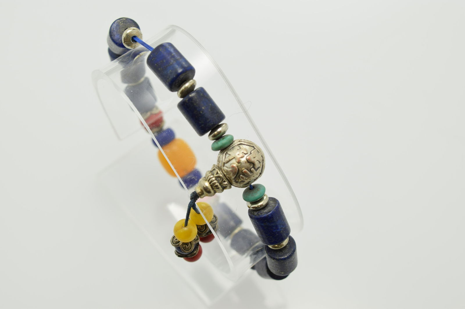 A stretch bracelet of navy blue clay beads, silver tone (1 of 2)