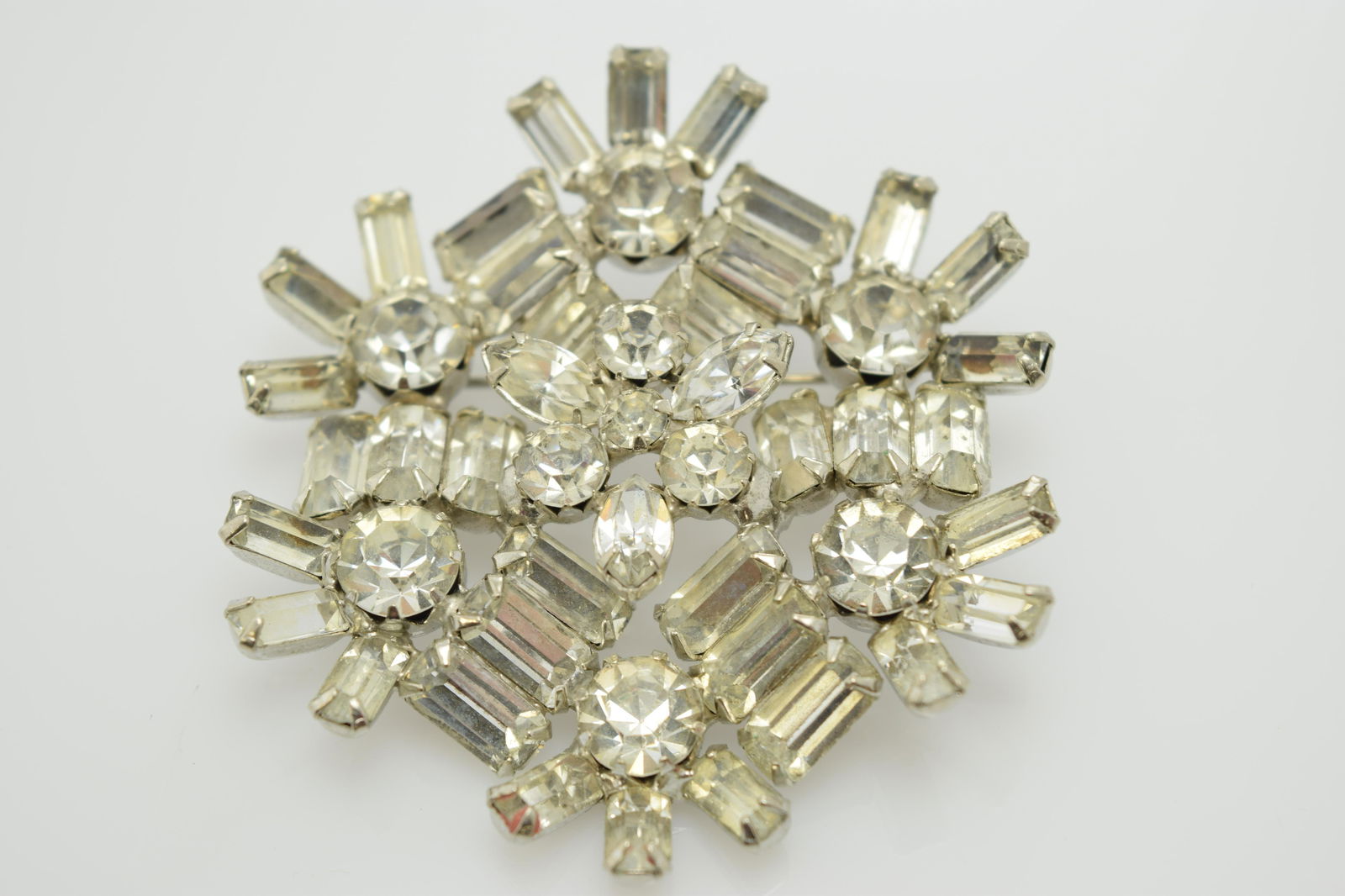 A 3 dimensional rhinestone pin. (1 of 4)