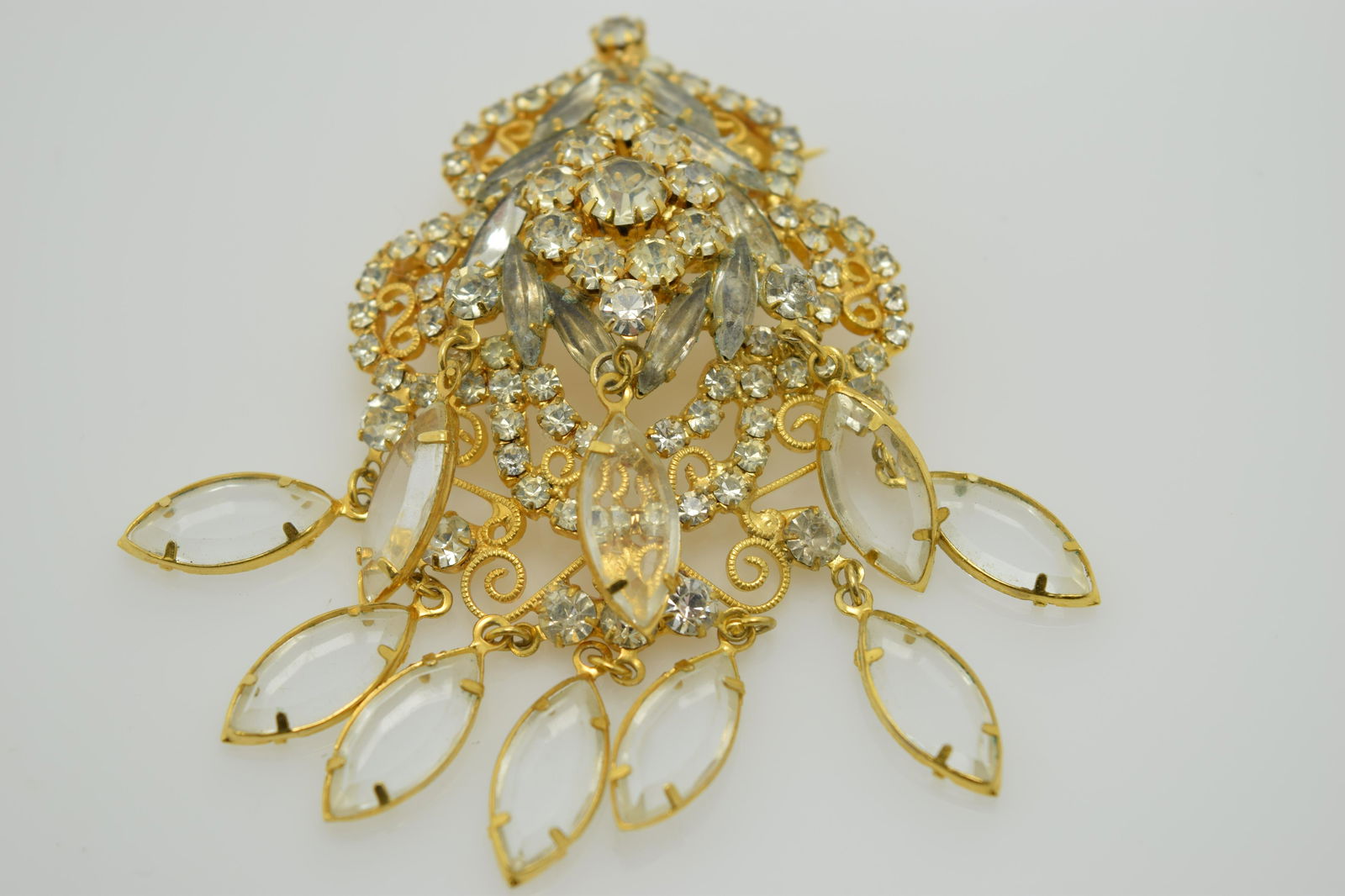 A vintage rhinestone pin with clear stone dangles. (1 of 3)
