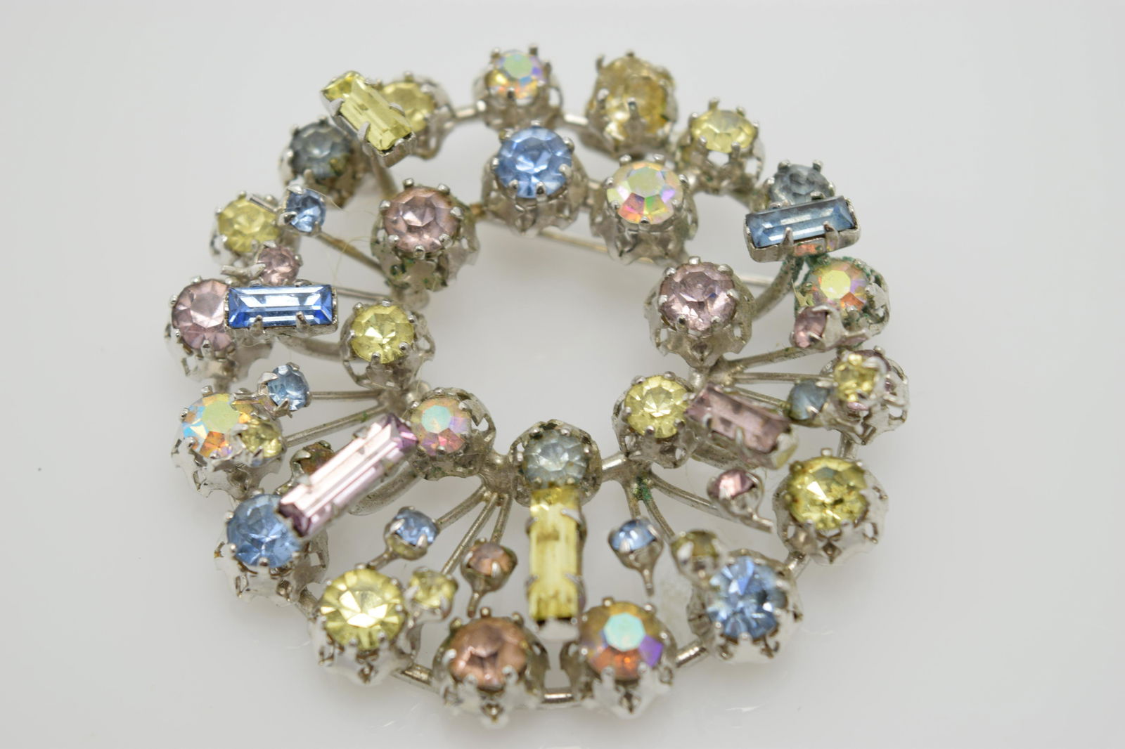 A blue and clear rhinestone pin. (1 of 3)