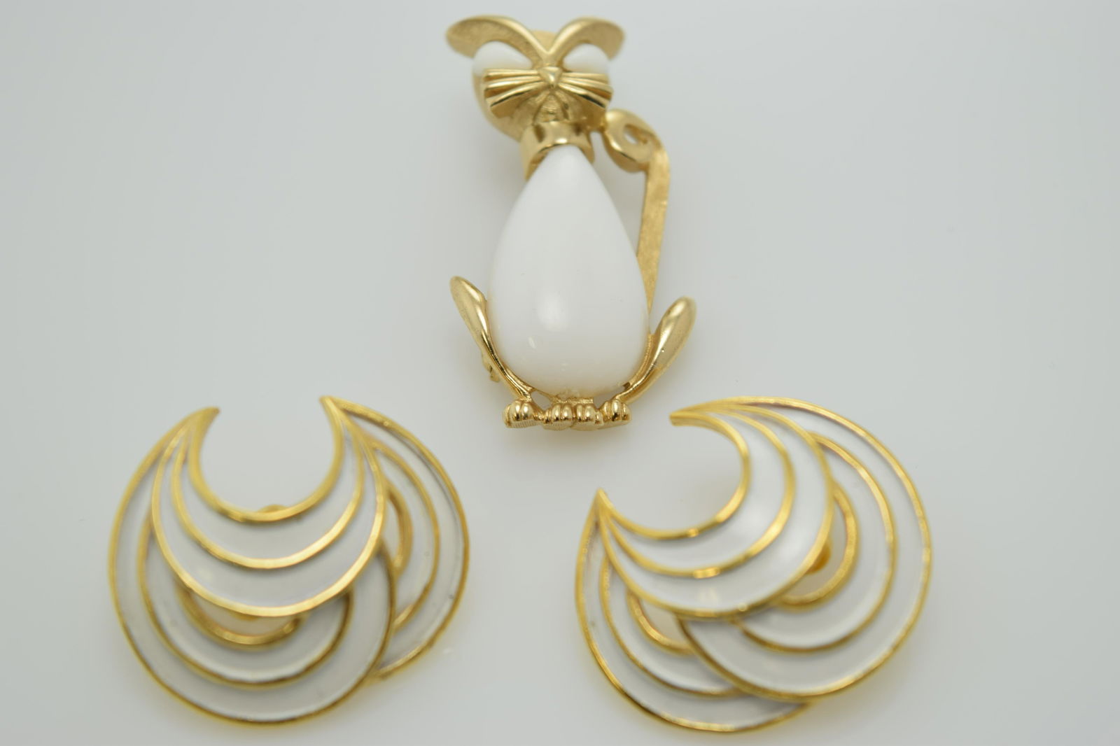 A lot of signed Trifari pin and earrings. (1 of 4)