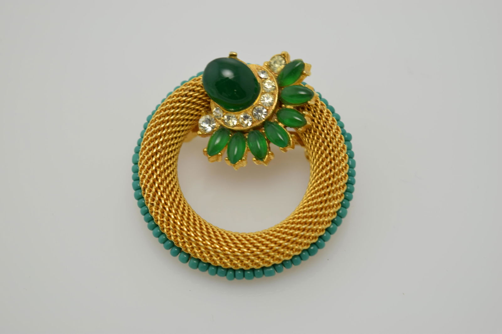 A signed Florenza gold tone circle pin with green (1 of 2)
