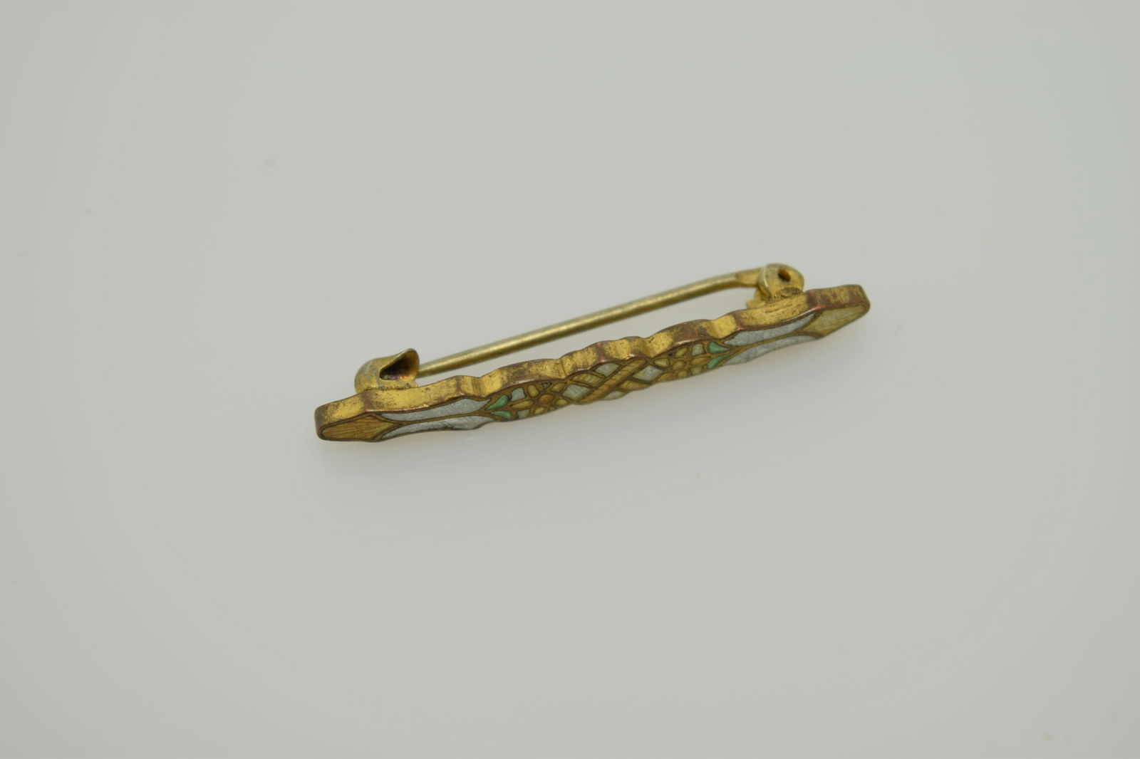 A tiny, Victorian enamel bar pin. (1 of 3)