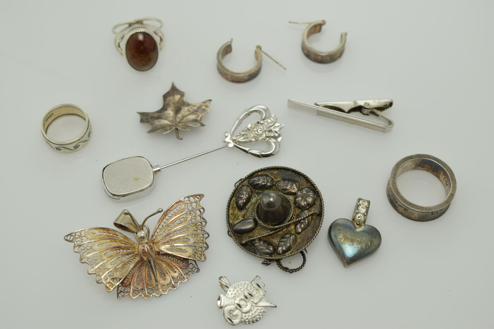 A lot of eleven miscellaneous sterling silver pieces of (1 of 2)