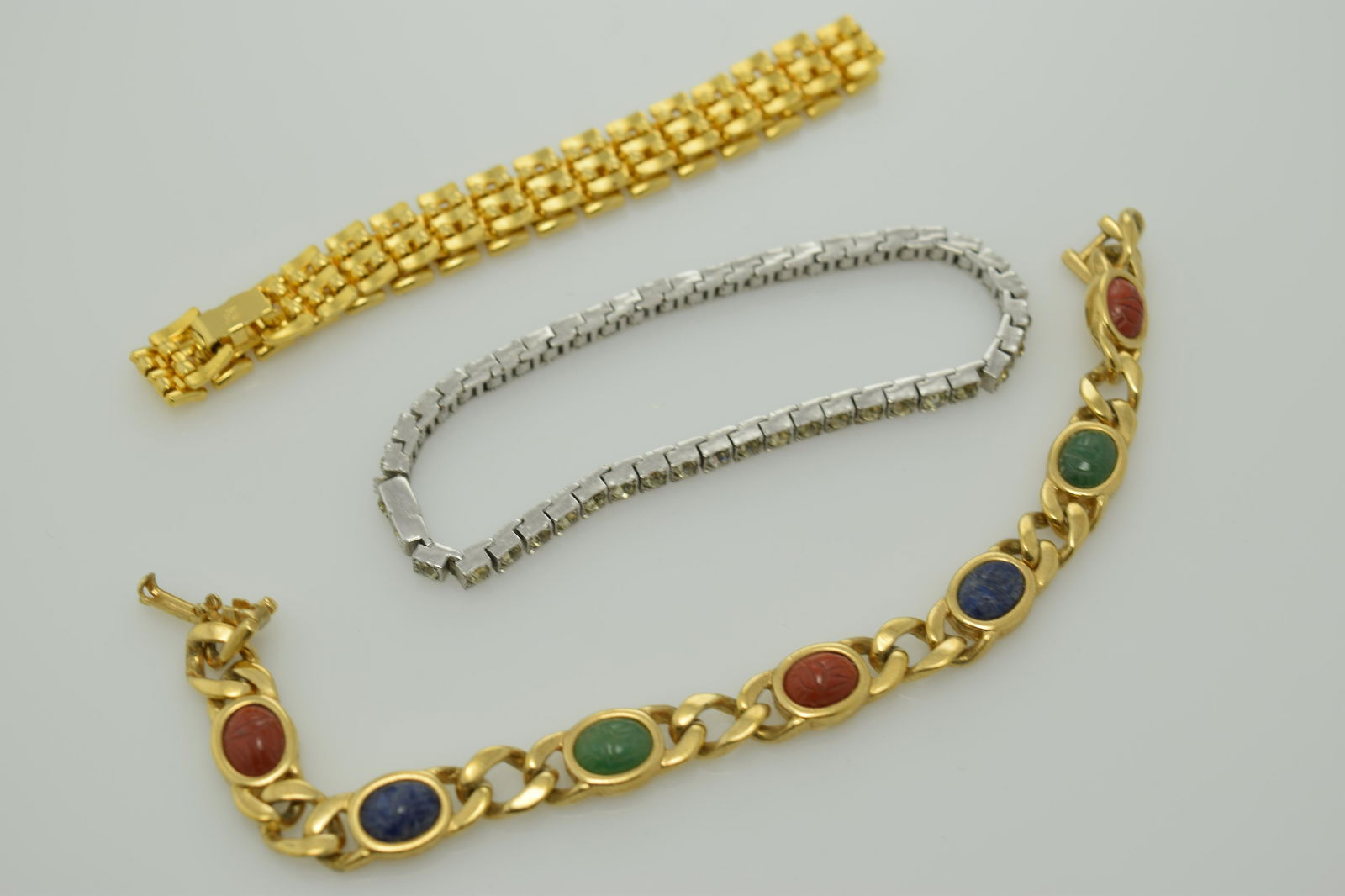 A lot of three vintage bracelets.  One has the maker's (1 of 2)