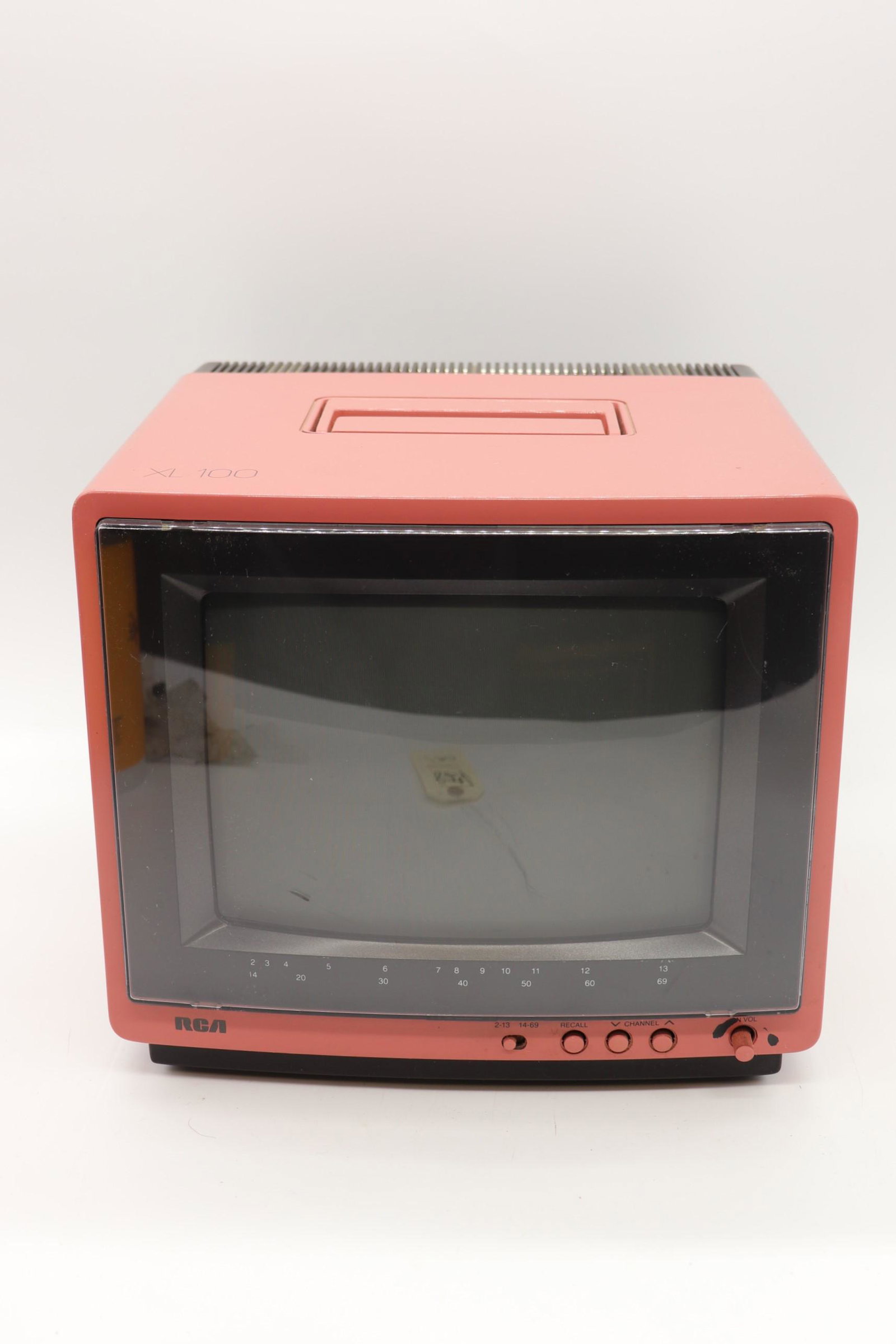 RCA XL100 Pink Potable TV, 1987: pink case, turns on and seems to be searching for channel, approx. 12 inch screen