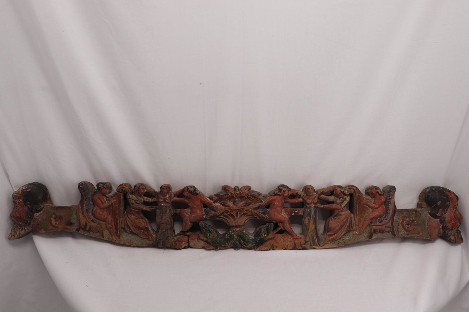 Early Hand Carving with Naked Women, Men's Heads and: appears to have been mounted on something at one time, great detail naked and dressed women 2 playing harps, carved men heads on either end and dolphins and flower basket in center, great detail, appr