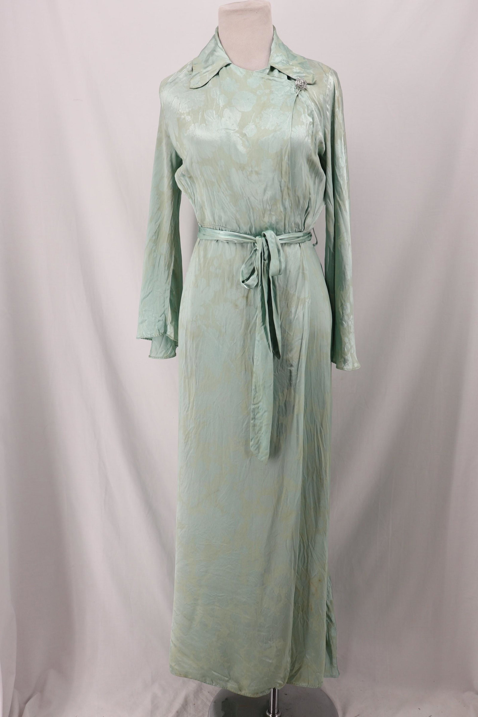 Vintage 1930's Green Satin Rayon Dressing Gown/Robe: floral satin Rayon with long bell sleeves, slight wing collar, glass button and loop at left, wrap front with snap at left waist, full length, matching tie belt, approx. 34 bust, 24 waist, some stains
