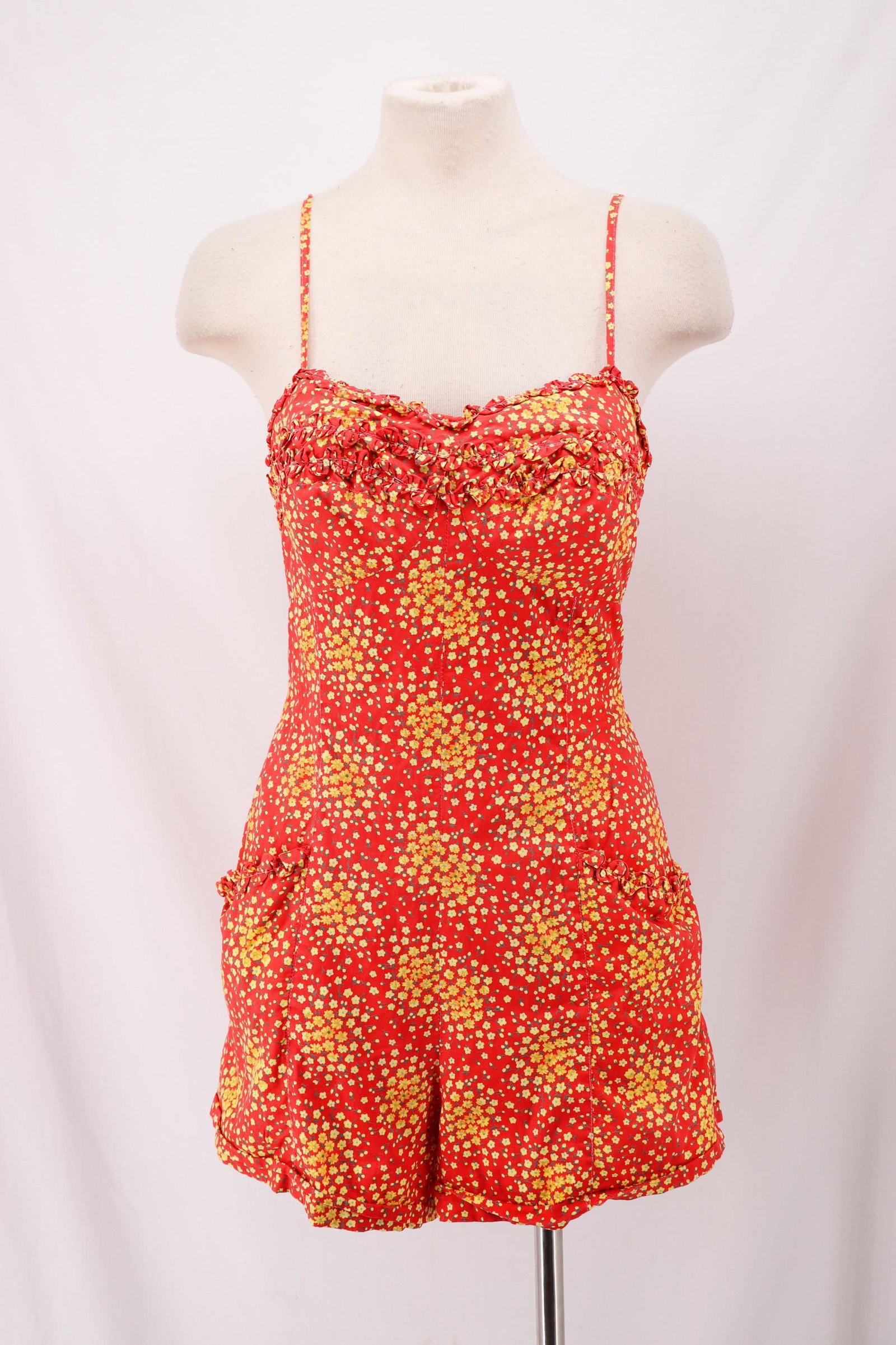 Vintage 1940's Cotton Print Bathing Suit by Brilliant: red cotton with tiny yellow flowers, spaghetti straps, sweet heart bodice with ruffles, boy cut legs, front pockets with ruffled trim, back metal zipper, lining from waist down, size 38, good conditio