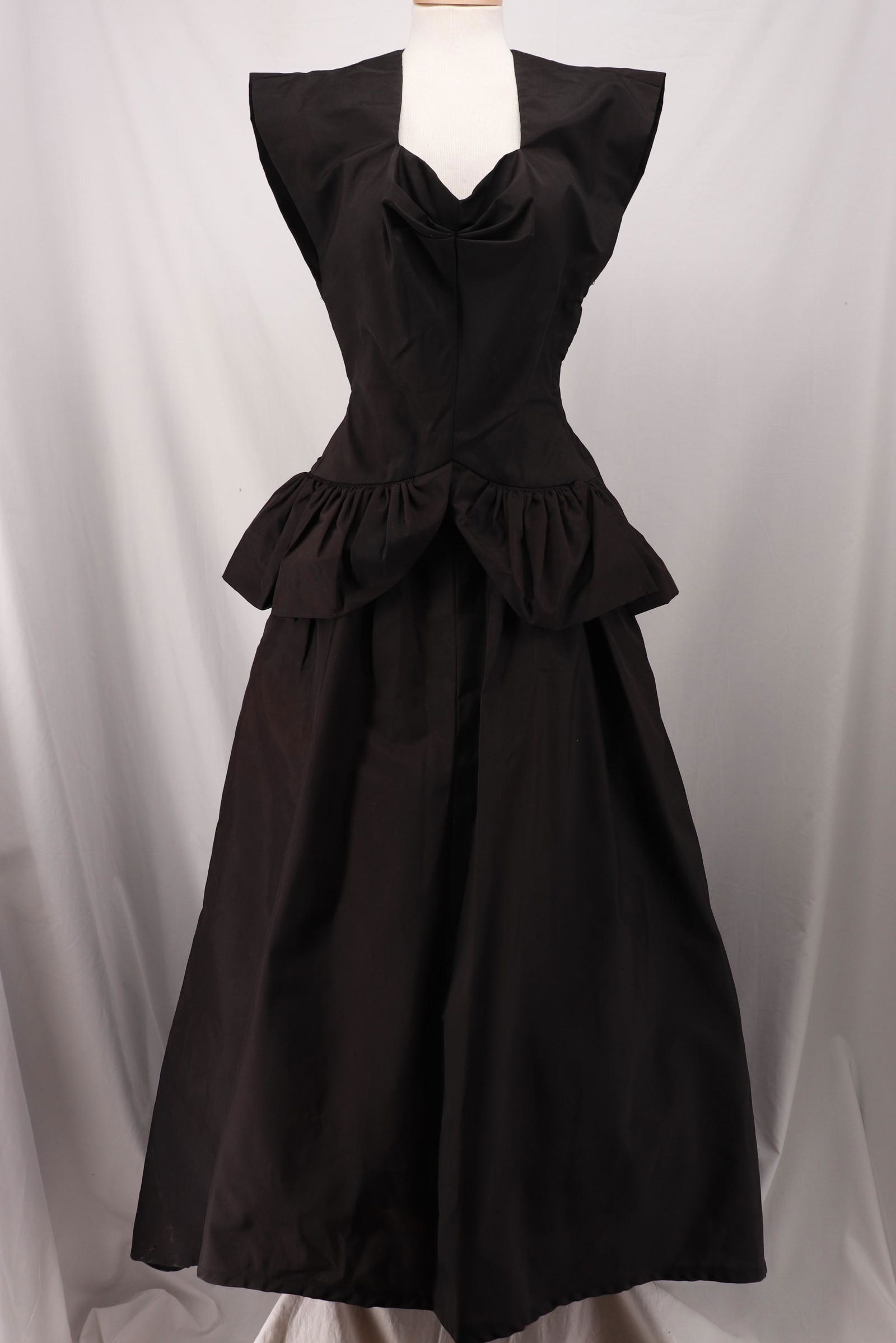 Vintage 1930's Black Peplum Gown: cap sleeves, sweet heart bodice with ruched neckline, fitted waist, side metal zipper, gathered peplum skirt with smocking under, skirt longer in back, stiff rayon blend, approx. 34 bust, 24 waist, so