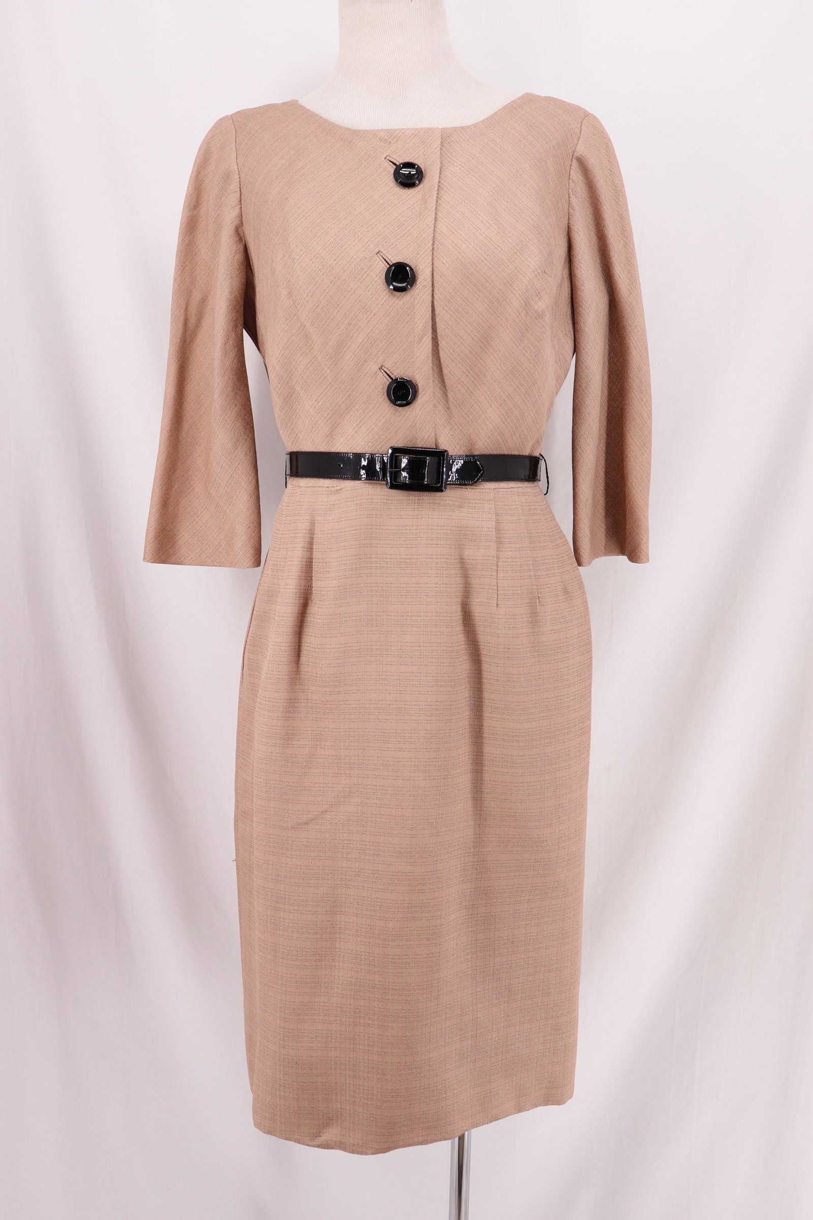 Vintage 1960's Cocktail Wiggle Dress: 3/4 sleeve , bateau neck, faux button front, Darts at front of wiggle skirt. Back zipper, black pattern leather belt, Approx. 38 bust, 28 waist. ..slight under arm stains,. Good condition.