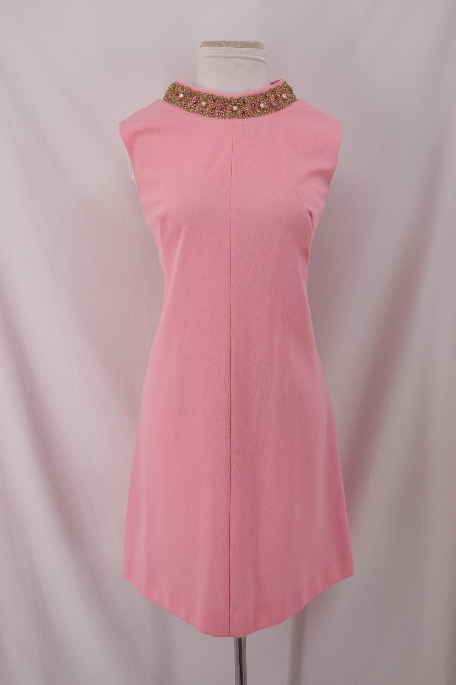 Vintage 1960's Shift Dress: sleeveless, rounded collar with gold tinsel applique, beads and rhinestones, straight skirt, back metal zipper Approx.38" Bust 36" Waist good condition
