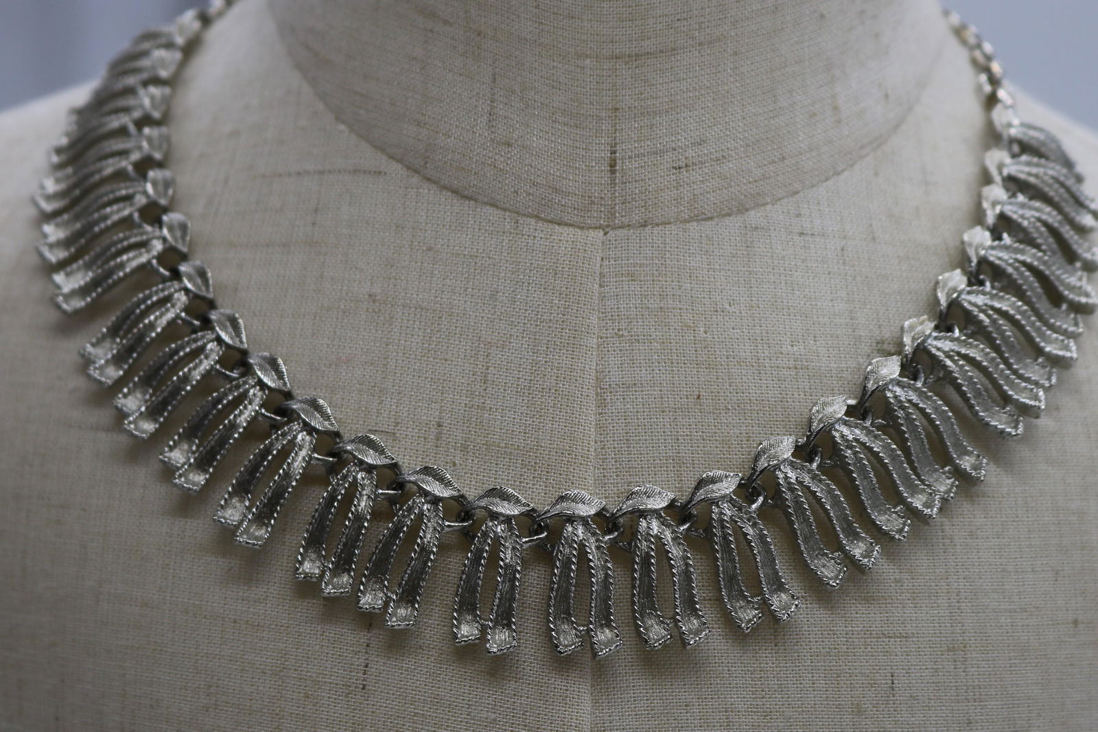 A Coro silver tone, vintage necklace and bracelet set.: A vintage, silver tone necklace & bracelet set. The necklace is adjustable (12"-16") & the bracelet is approx. 7-1/4". The necklace has a Coro hang tag. Both are in good condition.