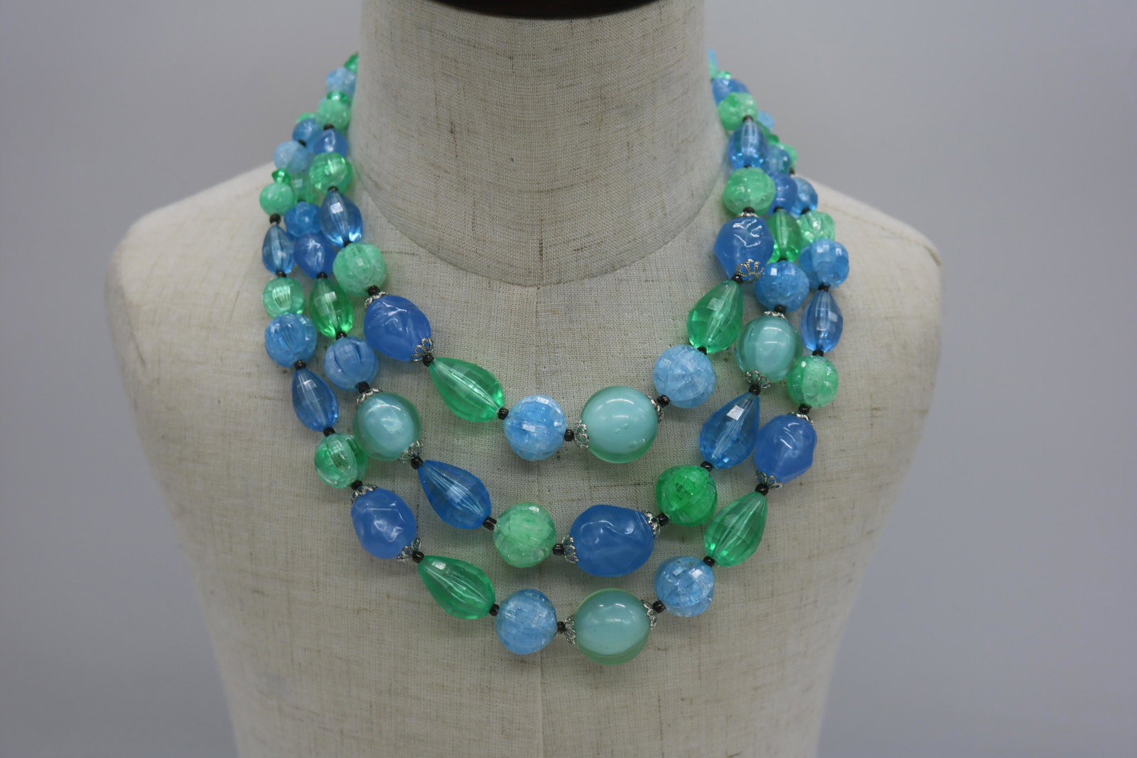 A 1950's three strand blue and green plastic bead (1 of 5)