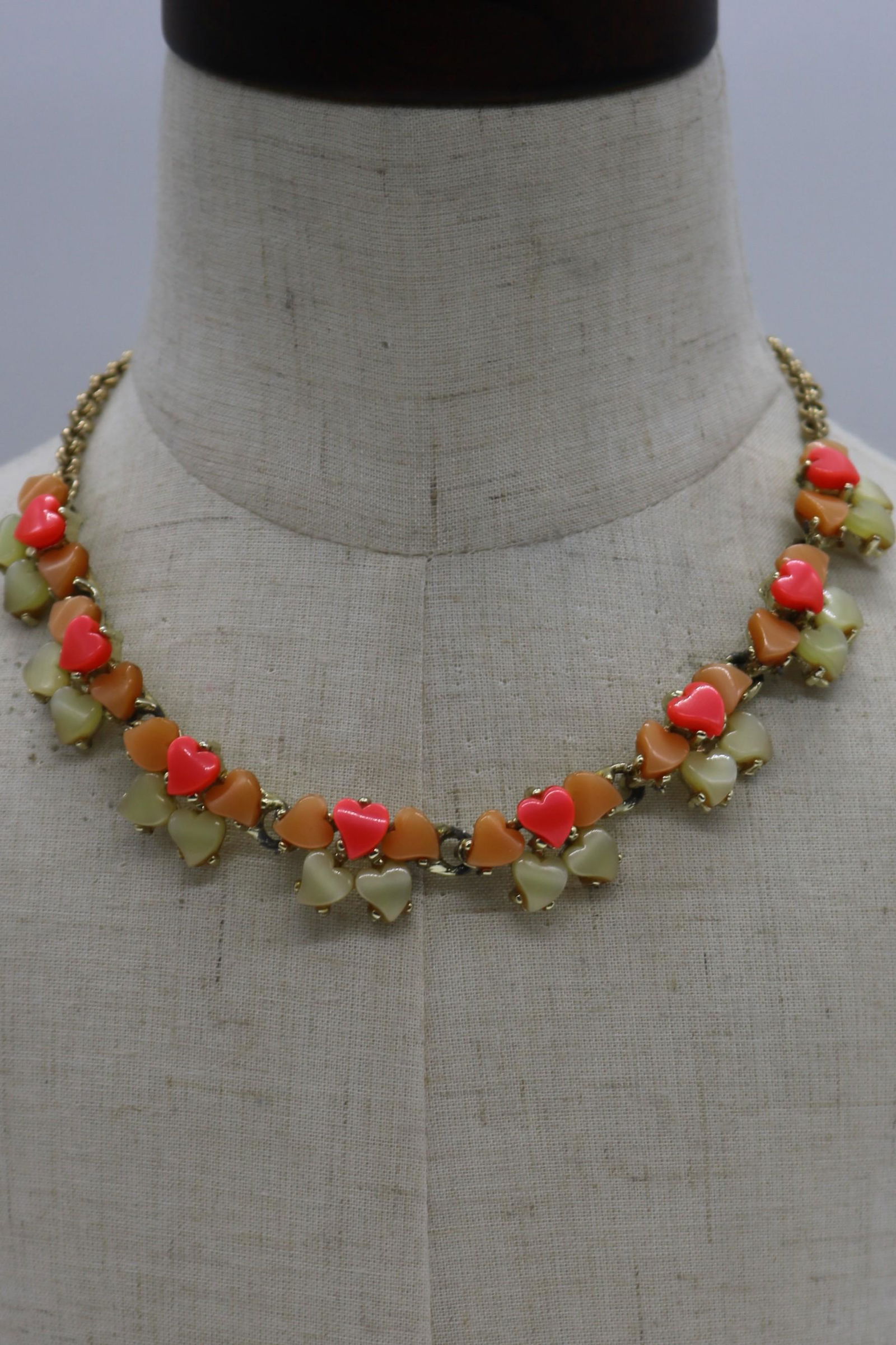 A vintage orange and tan Lucite thermoset necklace, (1 of 5)