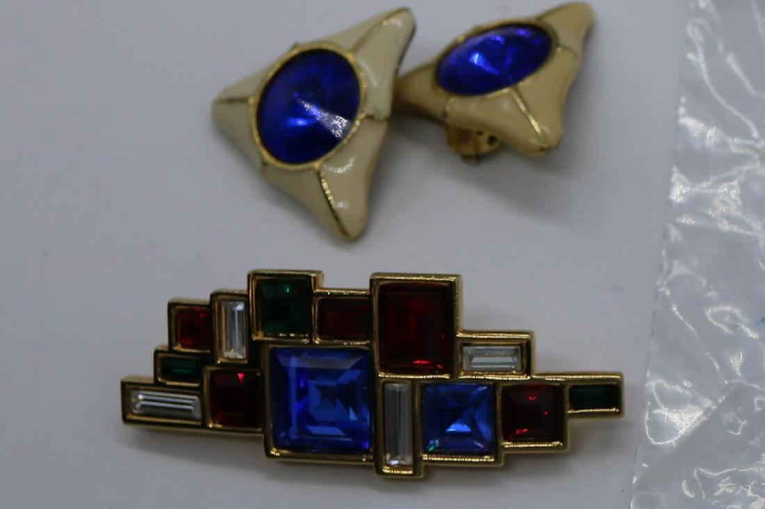 A red, blue, clear, and green stone pin/brooch and a (1 of 5)