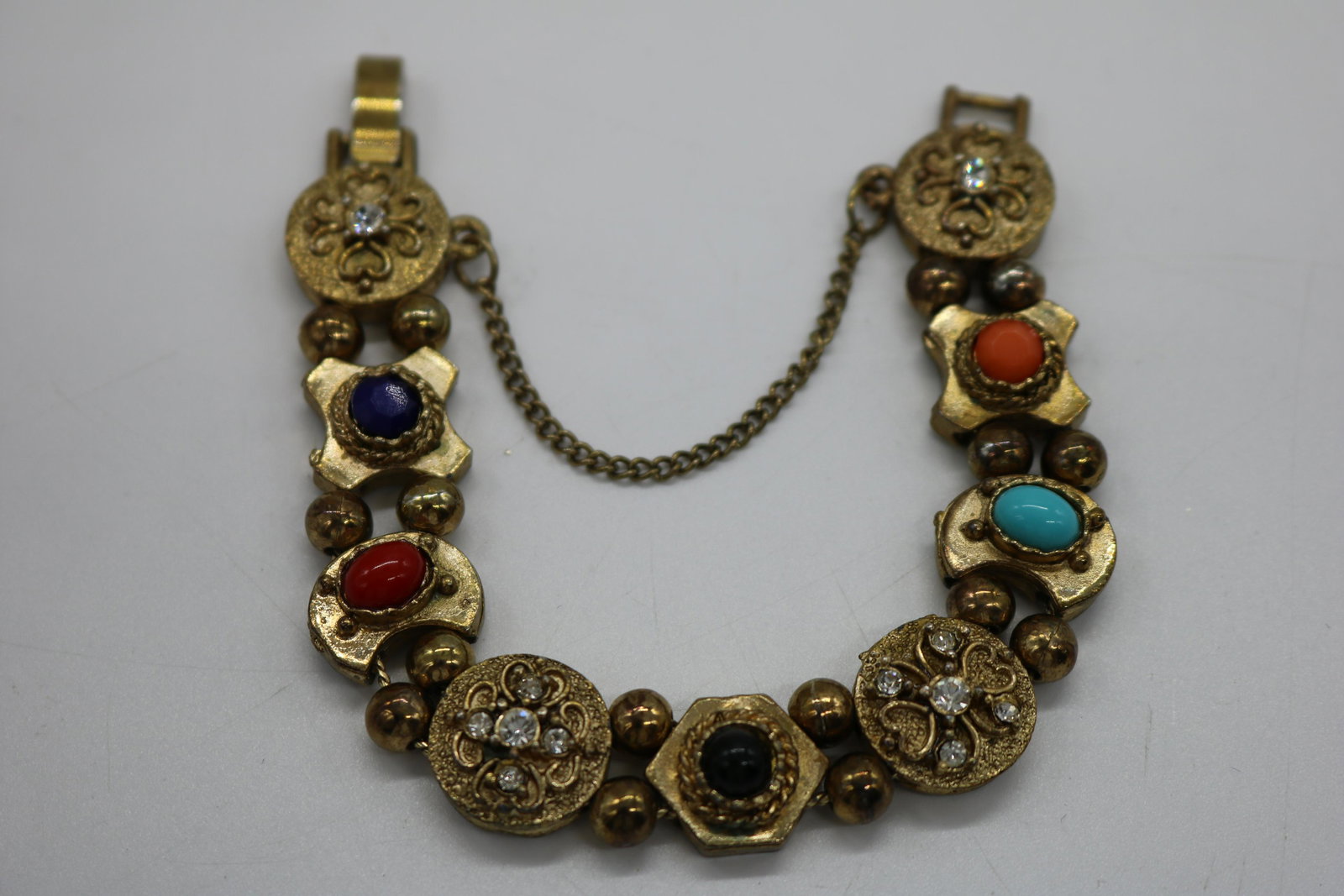 A vintage slide bracelet with nine sliding panels. (1 of 2)