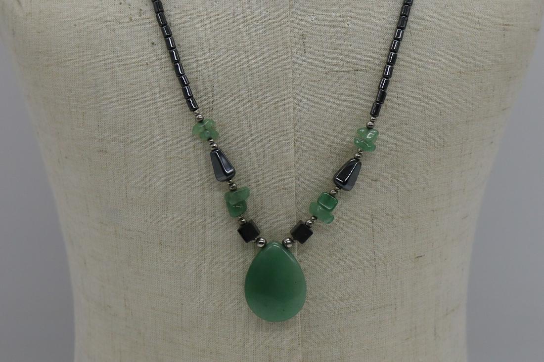 A modern necklace with jadeite and hematite beads. (1 of 2)
