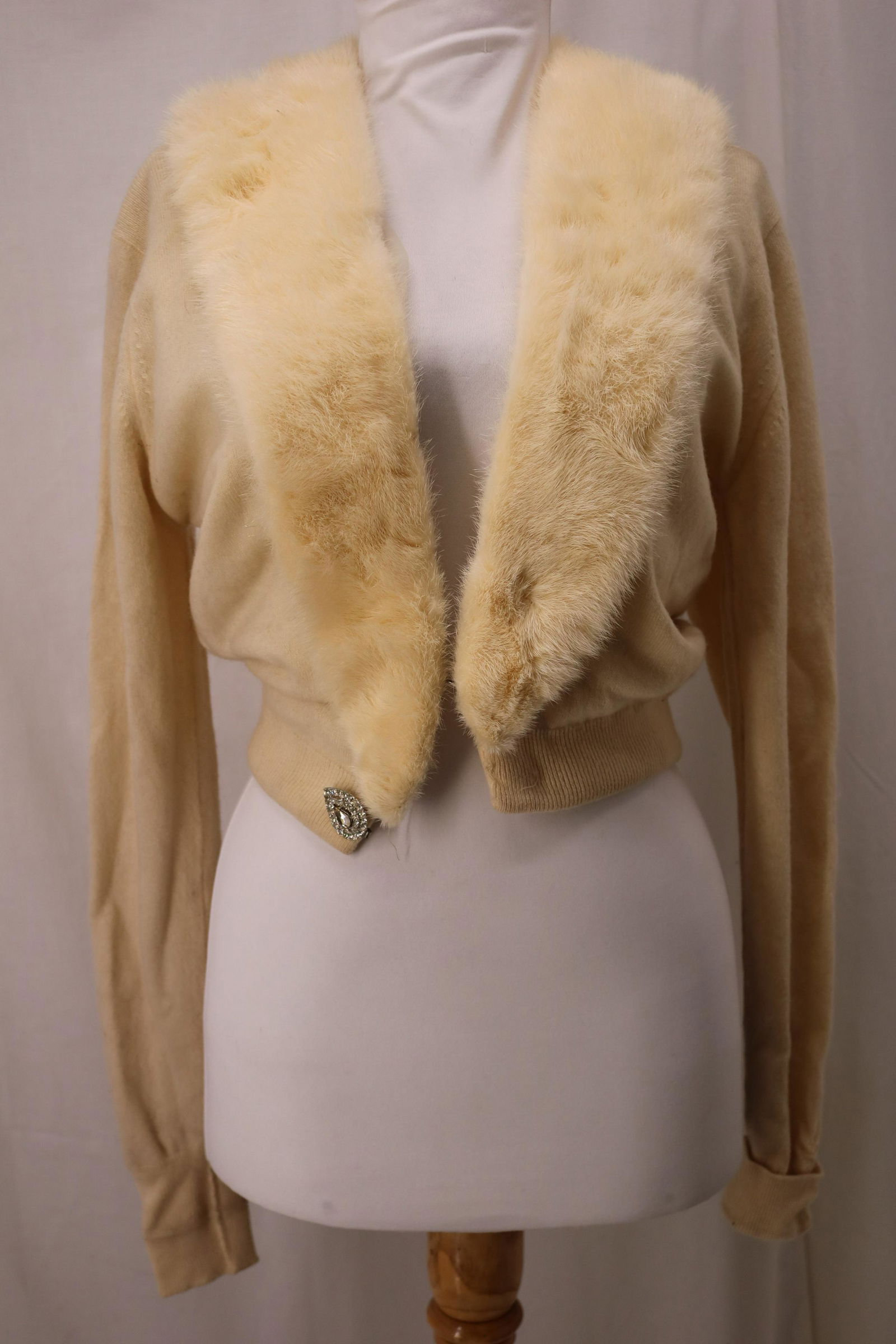 Vintage 1960's Pringle of Scotland Cashmere Cardigan: cream colored 100% Cashmere, detachable blonde mink collar with snaps, lace and mesh inner lining, hook and eye front closure with rhinestone button, Approx. 38" Bust, good condition.