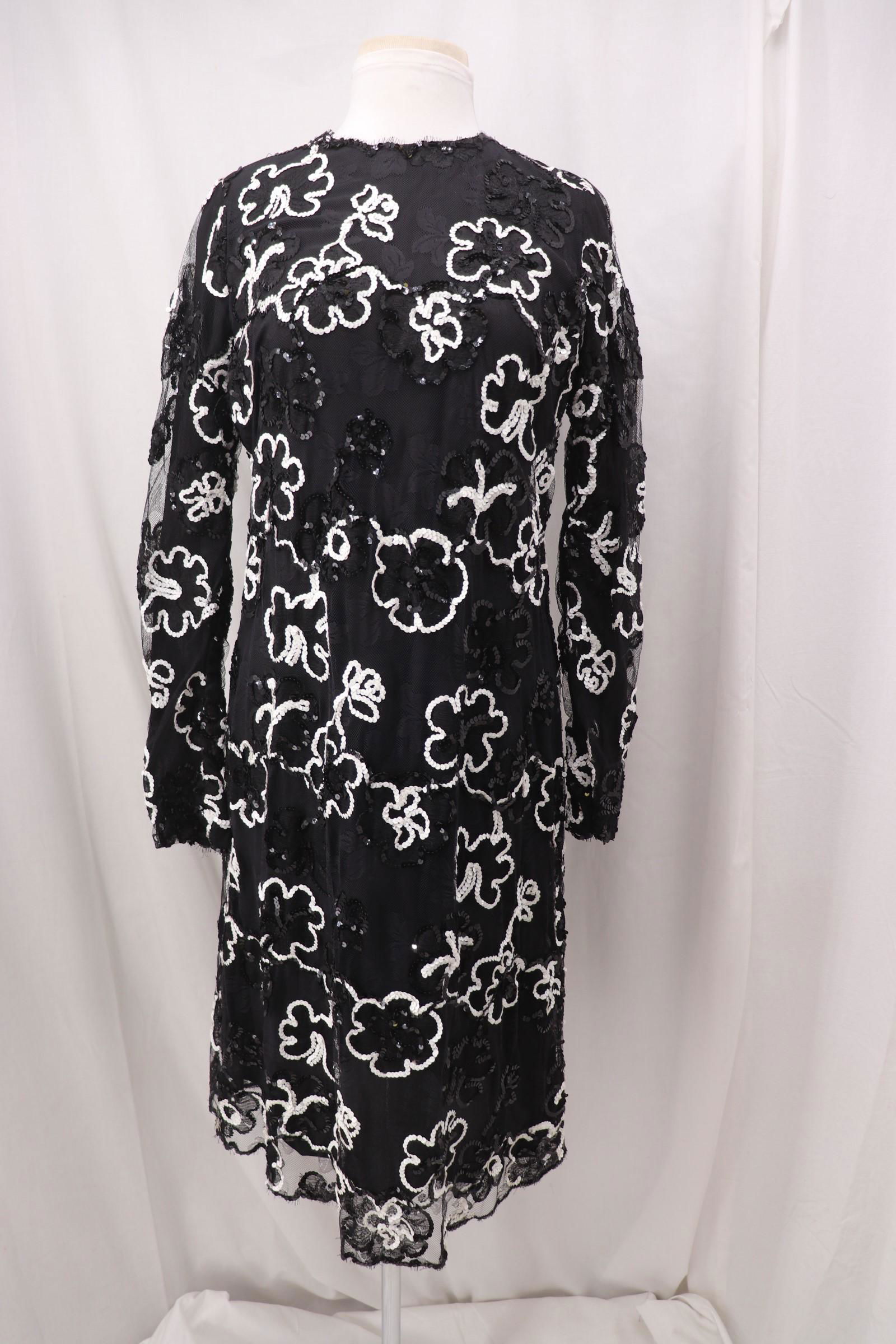 Vintage 1960's Black & White Floral Sequined Shift: round neck, long sleeves, black nylon blend dress with black mesh/lace overlay with black and white sequined flowers, back zipper, Approx. 38" Bust, 34" Waist, good condition.