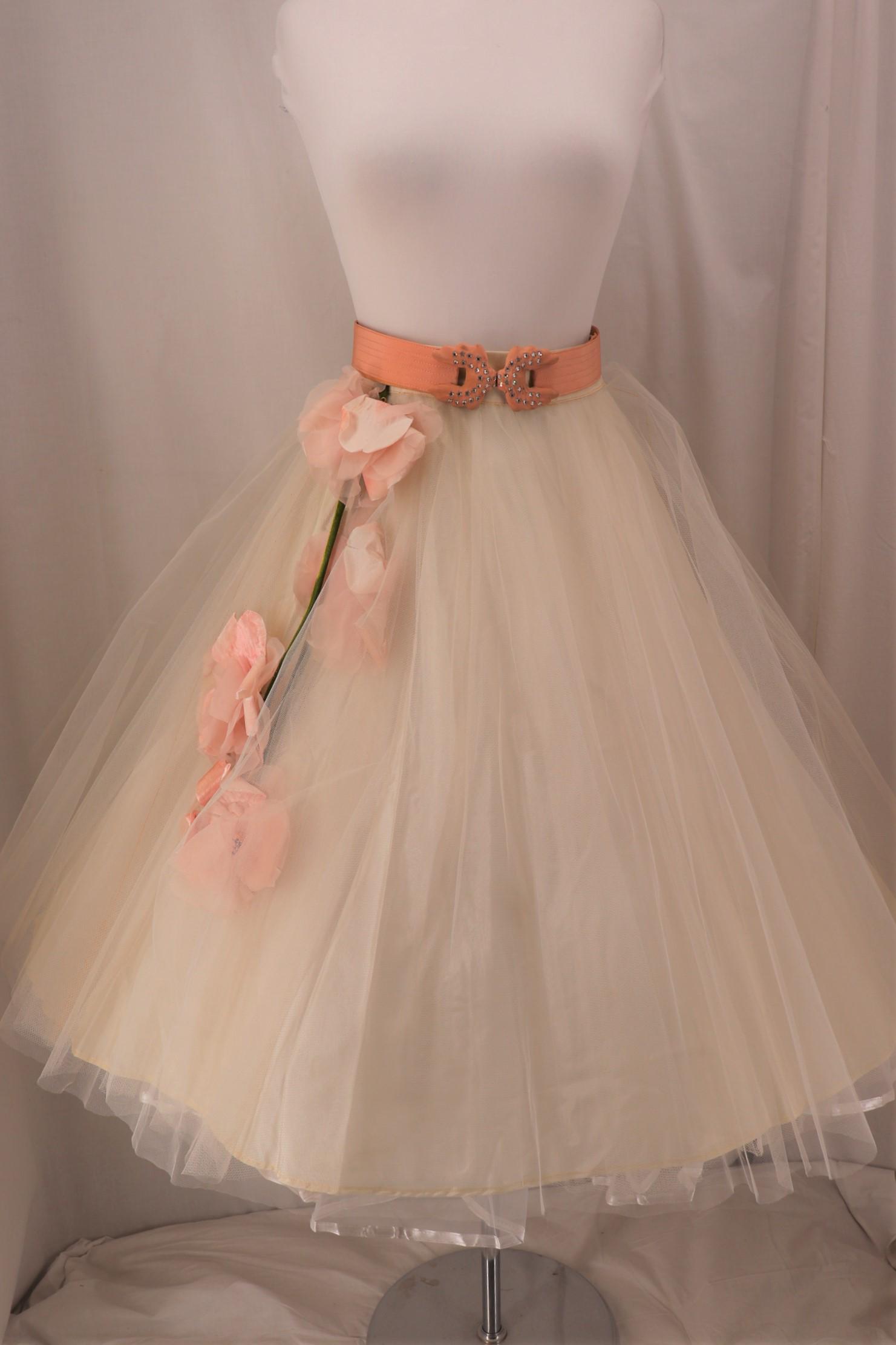 Vintage 1950's Tulle & Floral Skirt By Modern Junior: double layered tulle over acetate lining, large silk flowers and velvet stem, rhinestone belt is included but not original, Approx. 28" Waist, tulle pulling away from band in one spot, some damaged sp