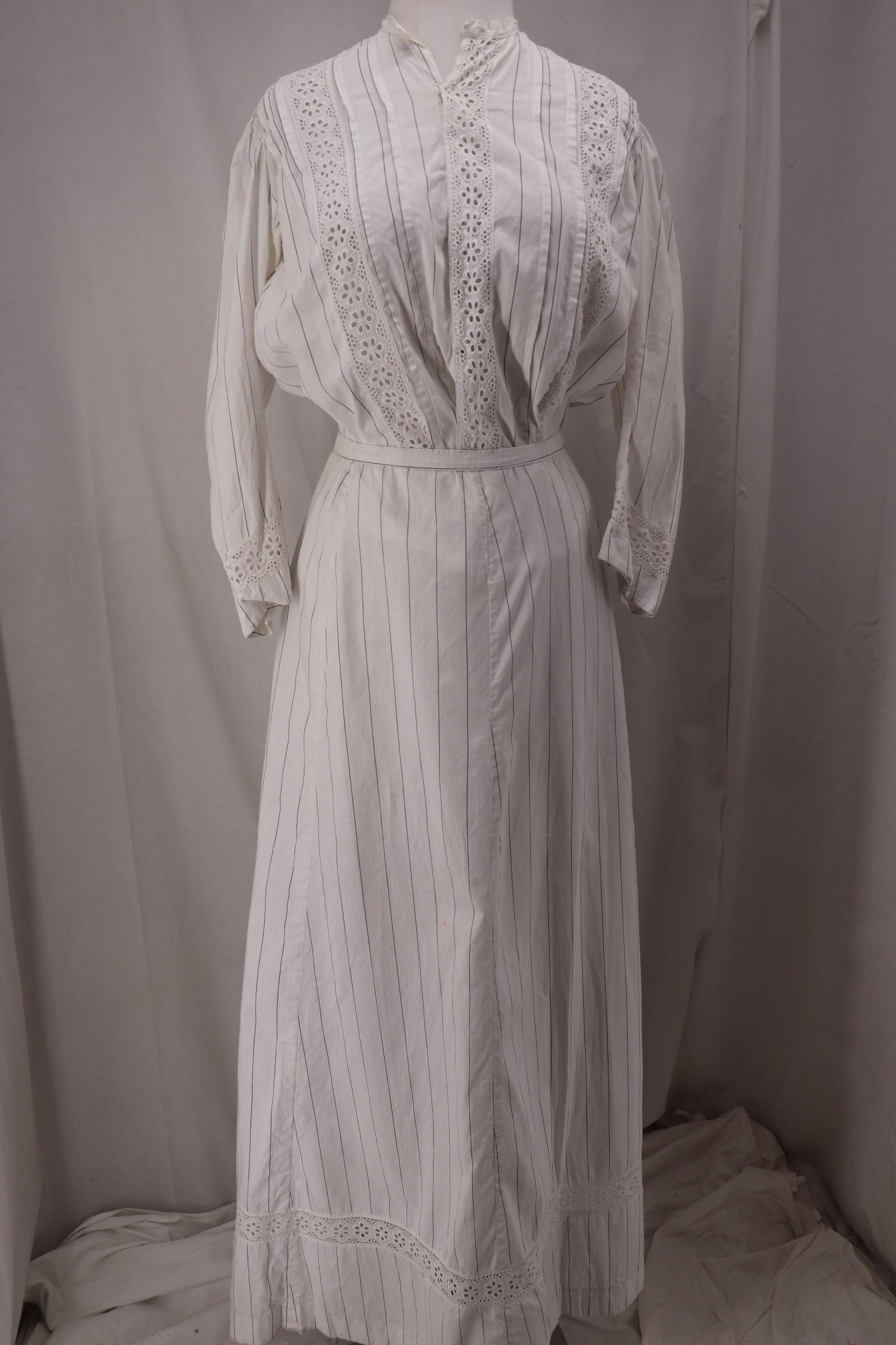 Antique 1910's 2PC White Linen Walking Set: blouse has 3/4 sleeves with floral eyelet inserts, pleated detail at shoulders, striped white cotton blend with floral eyelet insert panels, round neck, snap up front bustled back, Approx. 44" Bust/Wa