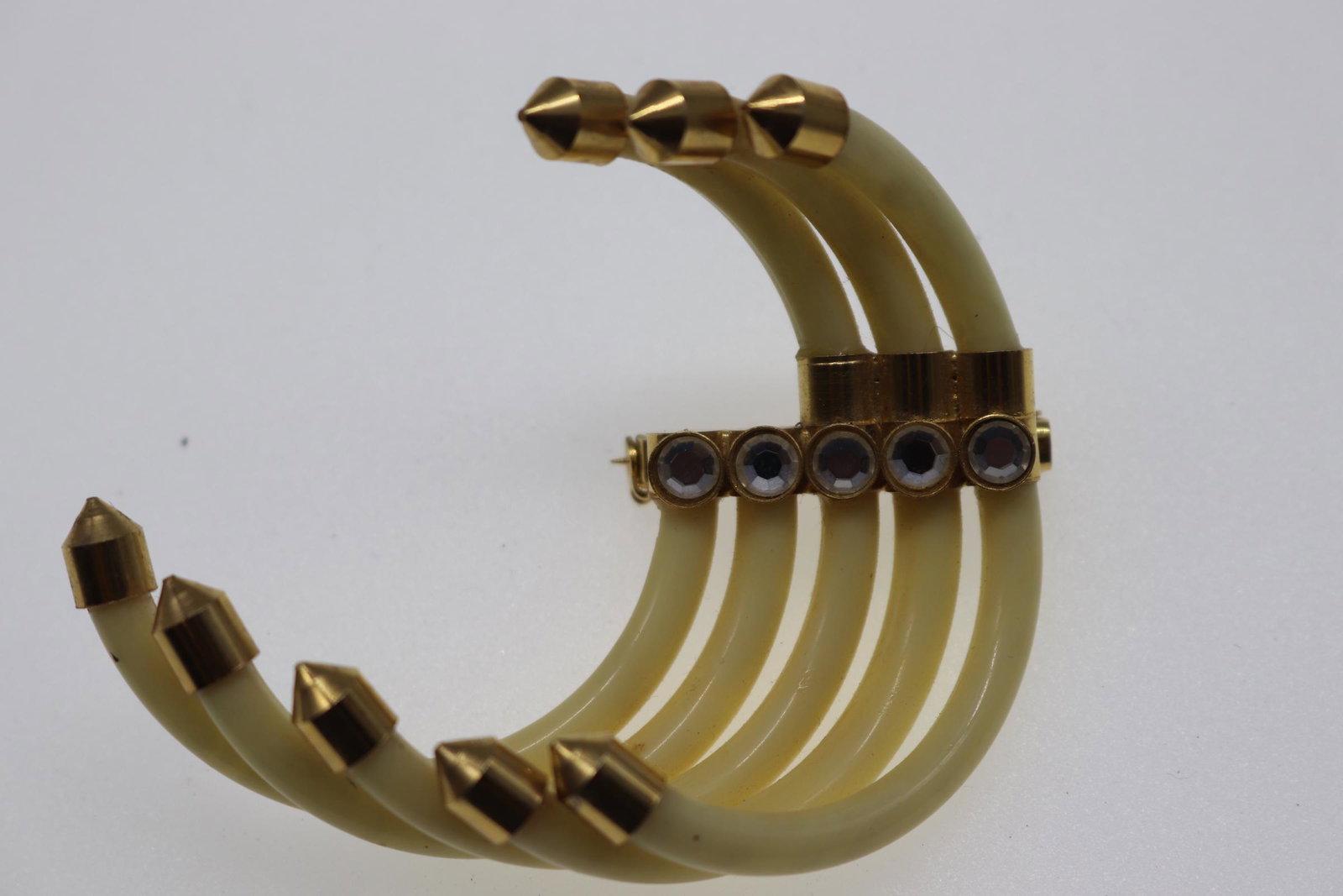 Vintage Swirl Brooch With Rhinestones: possible Lucite cream-colored swirl design with gold tone tips, rhinestone detail on center, Approx. 3", see photos