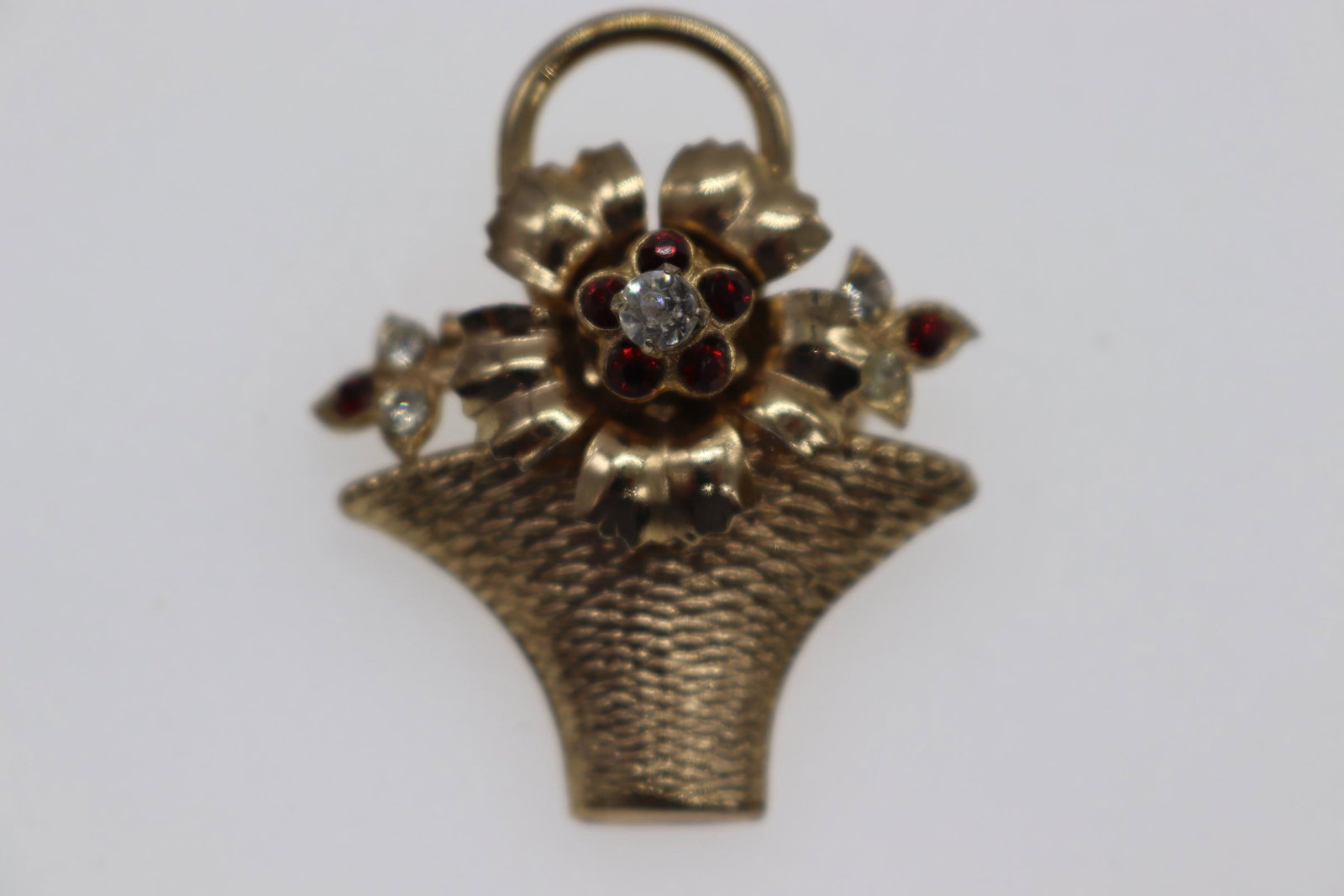 Vintage Signed Coro Gold-Toned Flower Basket Brooch: gold-toned flower basket brooch with rhinestone & garnet colored stone detail flowers, Approx. 1.5", see photos.