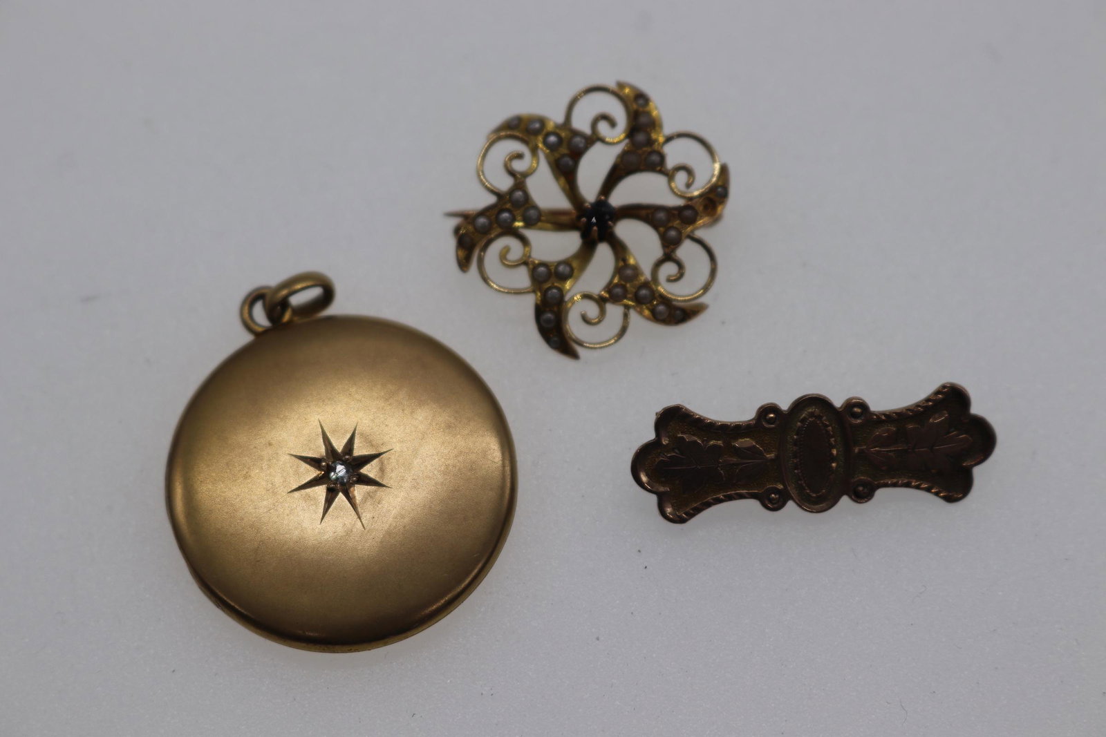 Lot of 3 Pieces of Vintage Jewelry: 2 gold-tone brooches, one gold tone locket pendant, see photos.
