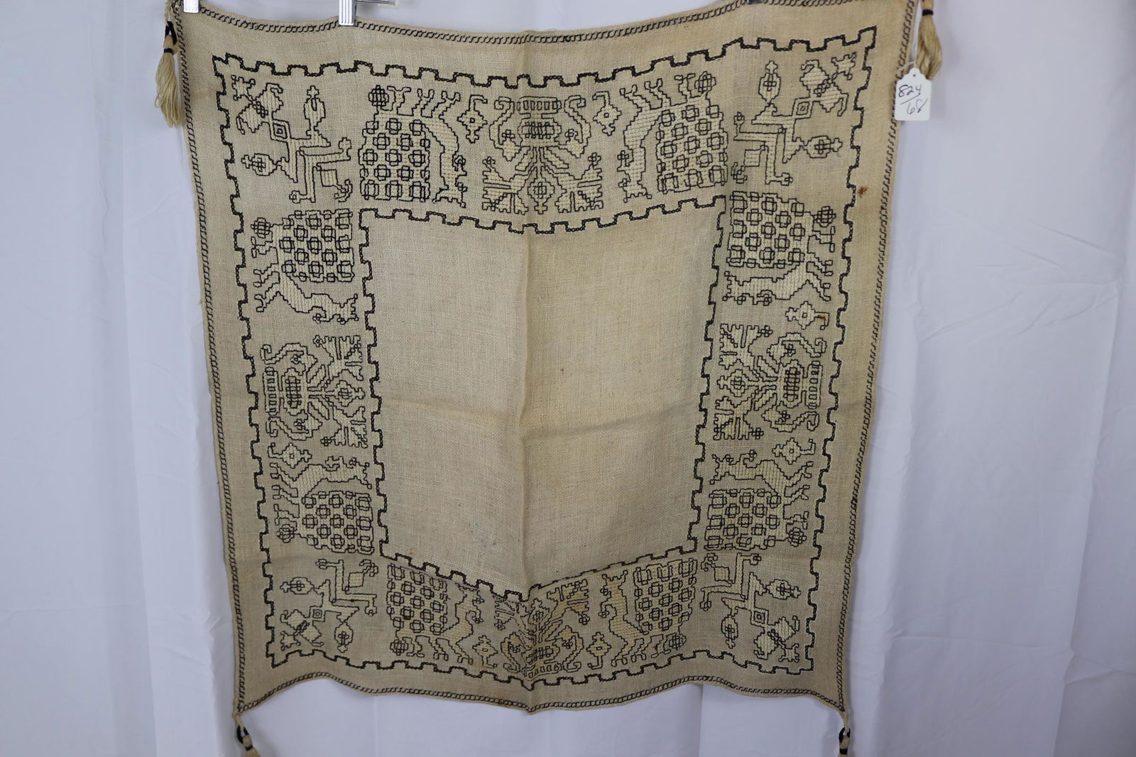 Vintage Cross Stitched Table Cover With Tassels: approx. 35x26, see photos for stains.