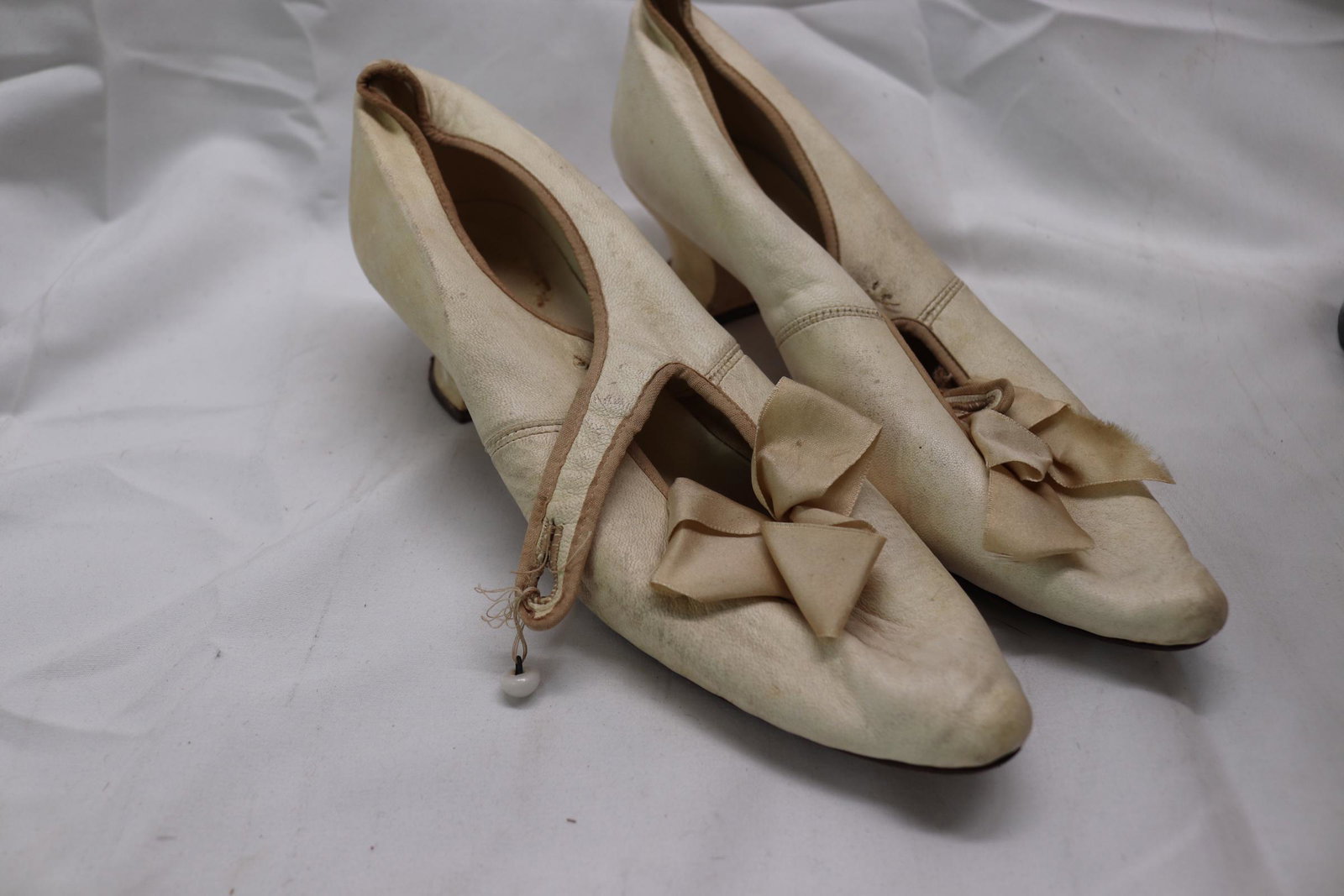 Antique Edwardian White Calfskin Heels: approx. 10" Toe to heel, see photos for stains and damage.