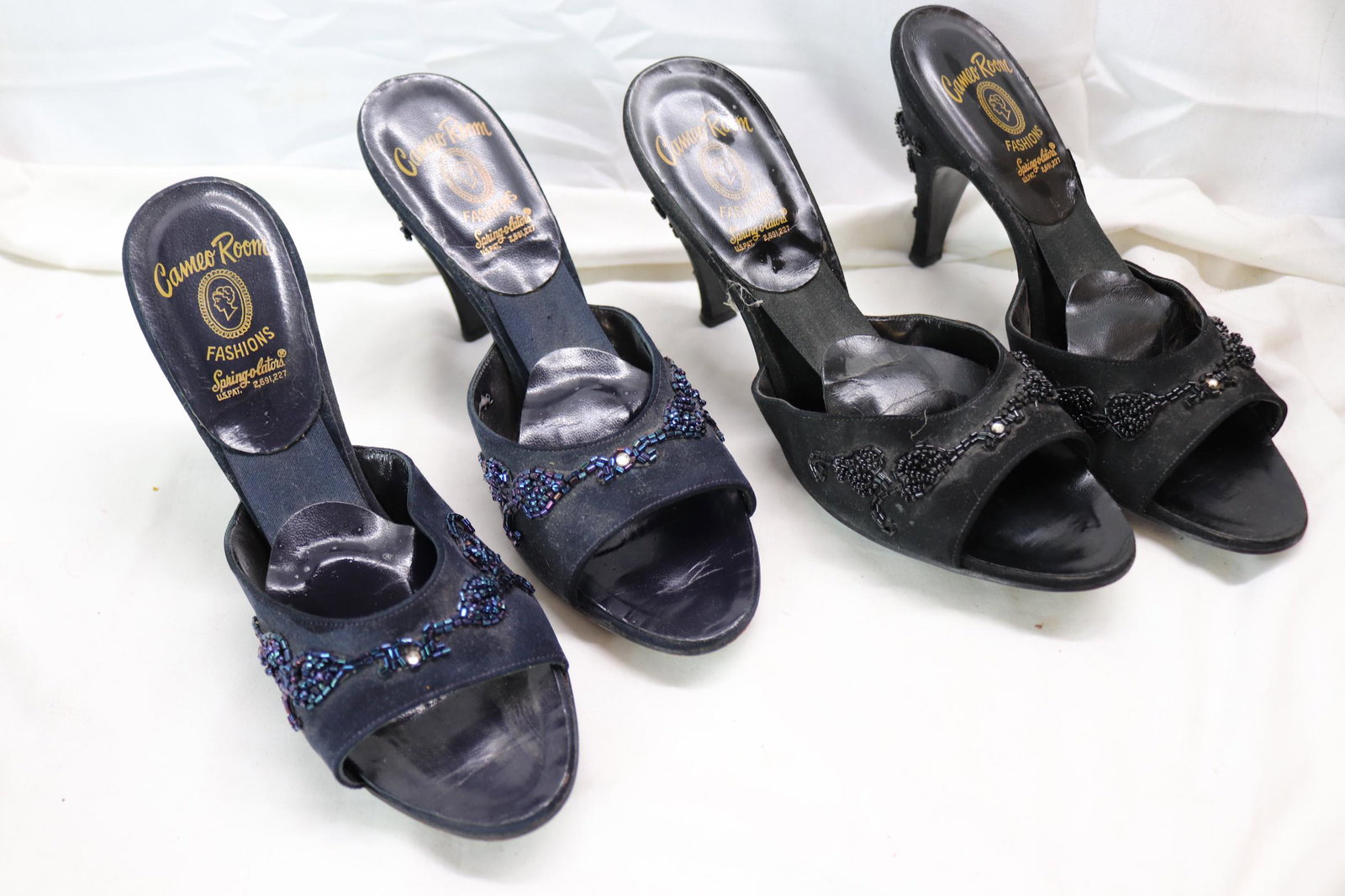 Lot of 2 Vintage 1950's Cameo Room Fashions Spring-o-lator Heels: peep-toe heels, one pair black with black beading size 10, other pair is navy with blue beading size 9.5, in worn condition, see photos.