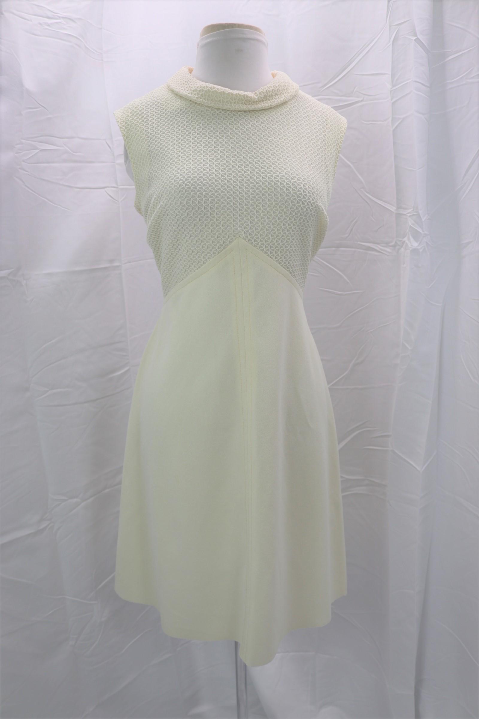 Vintage 1960's Myrette Sheath Dress: sleeveless, rolled collar, textured poly bodice, inverted V empire waist, white poly skirt, unhemmed, back zipper, Approx. 36" Bust, 32" Waist, mark on back of skirt, see photos.
