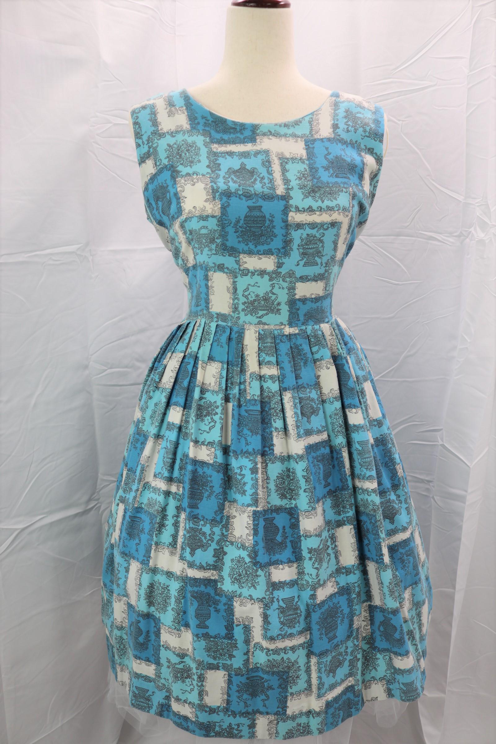 Vintage 1950's Mode O'Day Floral Pouf Dress: sleeveless, scoop neck, floral cotton blend, pleated skirt, back metal zipper, Approx. 36" Bust 32" Waist, good condition.