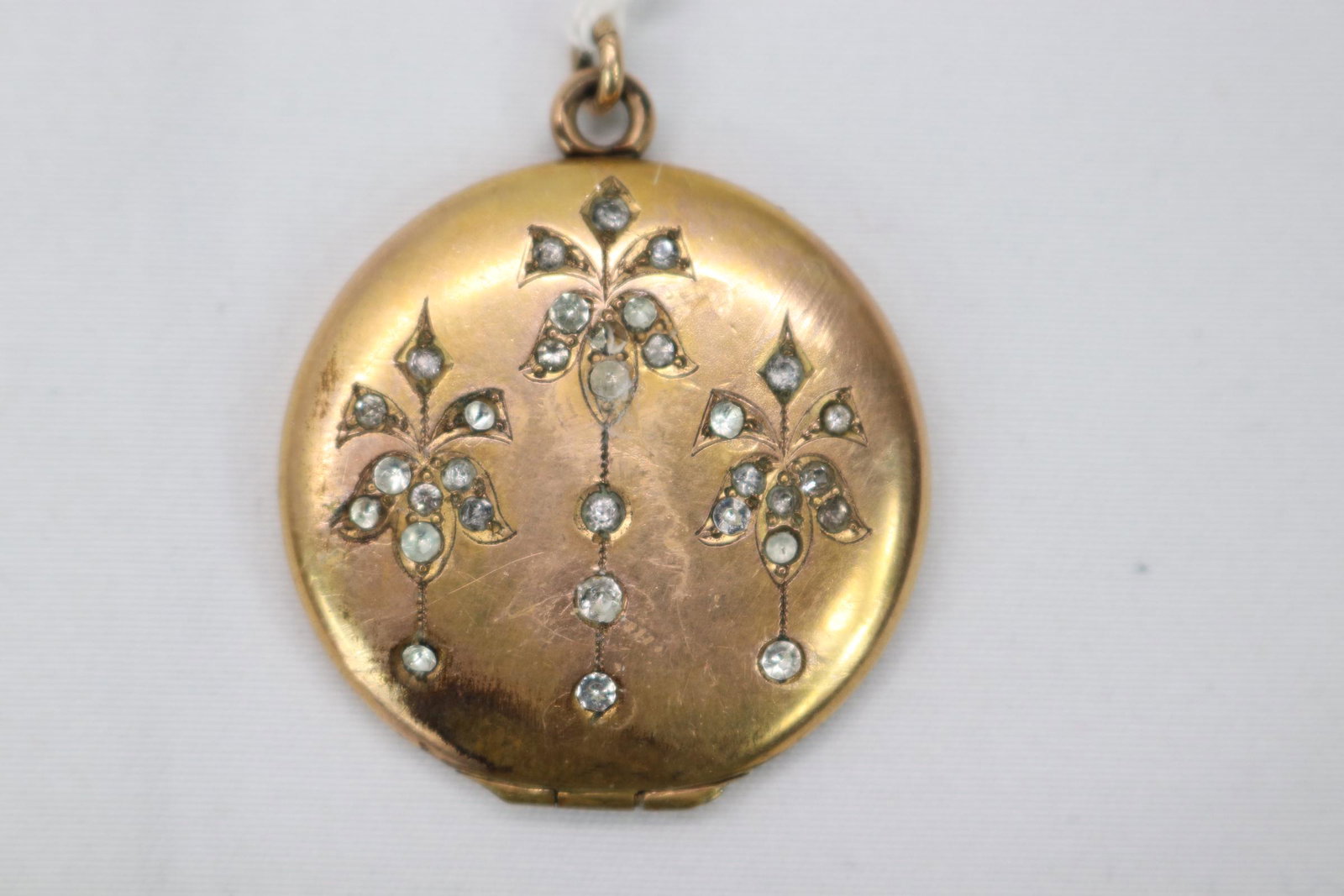 Victorian Gol Tone Locket with Rhinestones: holds 2 photo's marked inside with AZ, approx. 1 inch