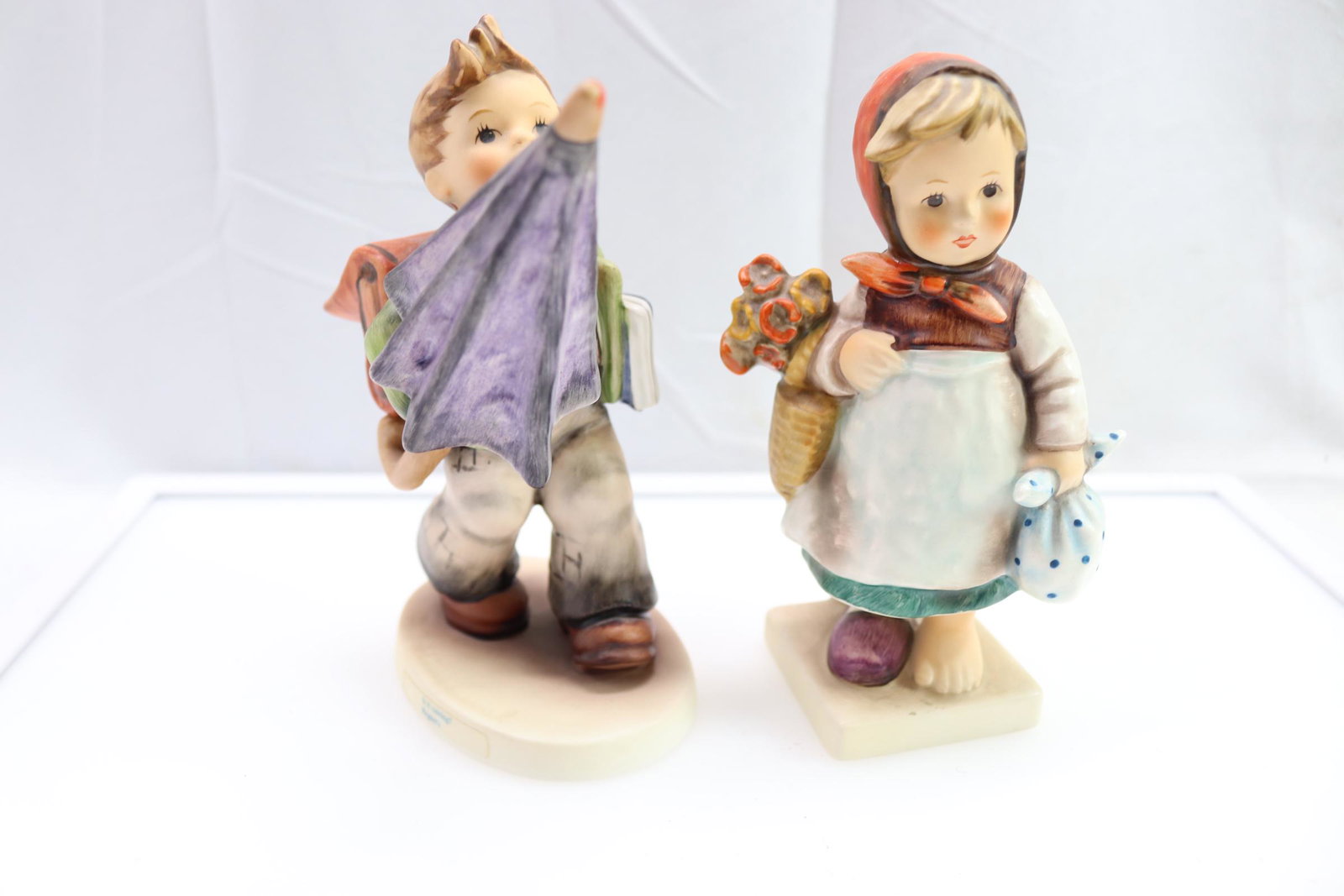 Lot of 2 Hummels Weary Wanderer & Is It Raining: approx. 6 inches tall