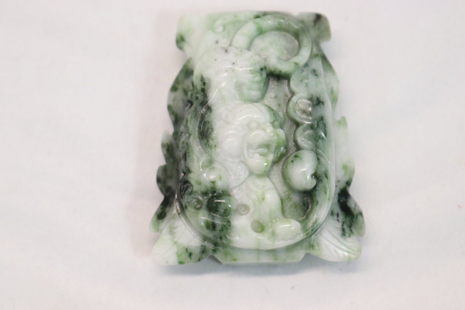 Chinese Green Hand Carved Jade Buckle with Lion: approx. 2 1/4 inches, see photo's