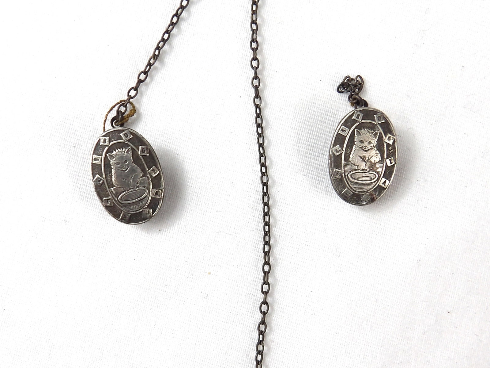 Antique Sweater Clips with Etched Cat & letters "BOGZAJKELI": engraved Ruth on back, see photo's