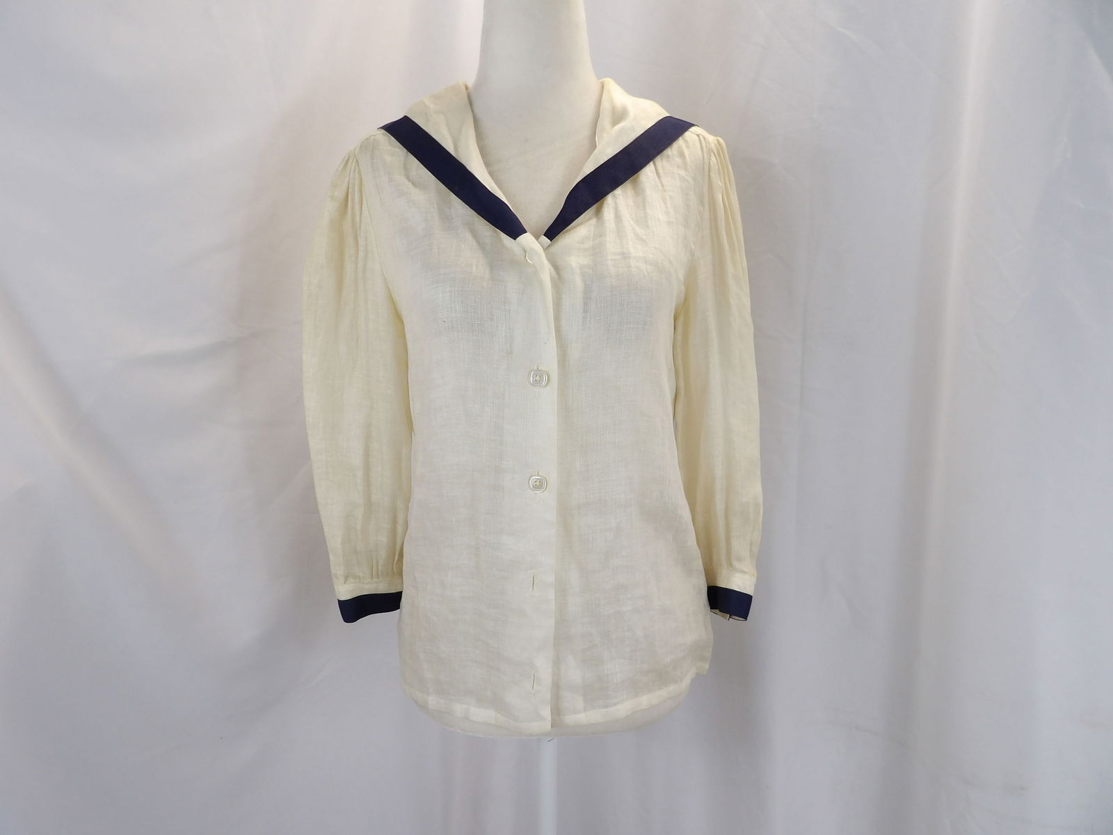 VINTAGE STACY BECKER 1950'S LINEN BLOUSE WITH NAVY TRIM: APPROX. 36 BUST, 34 WAIST, UNDERARM YELLOWING & MISSING 2 BUTTONS. SEE PHOTOS.