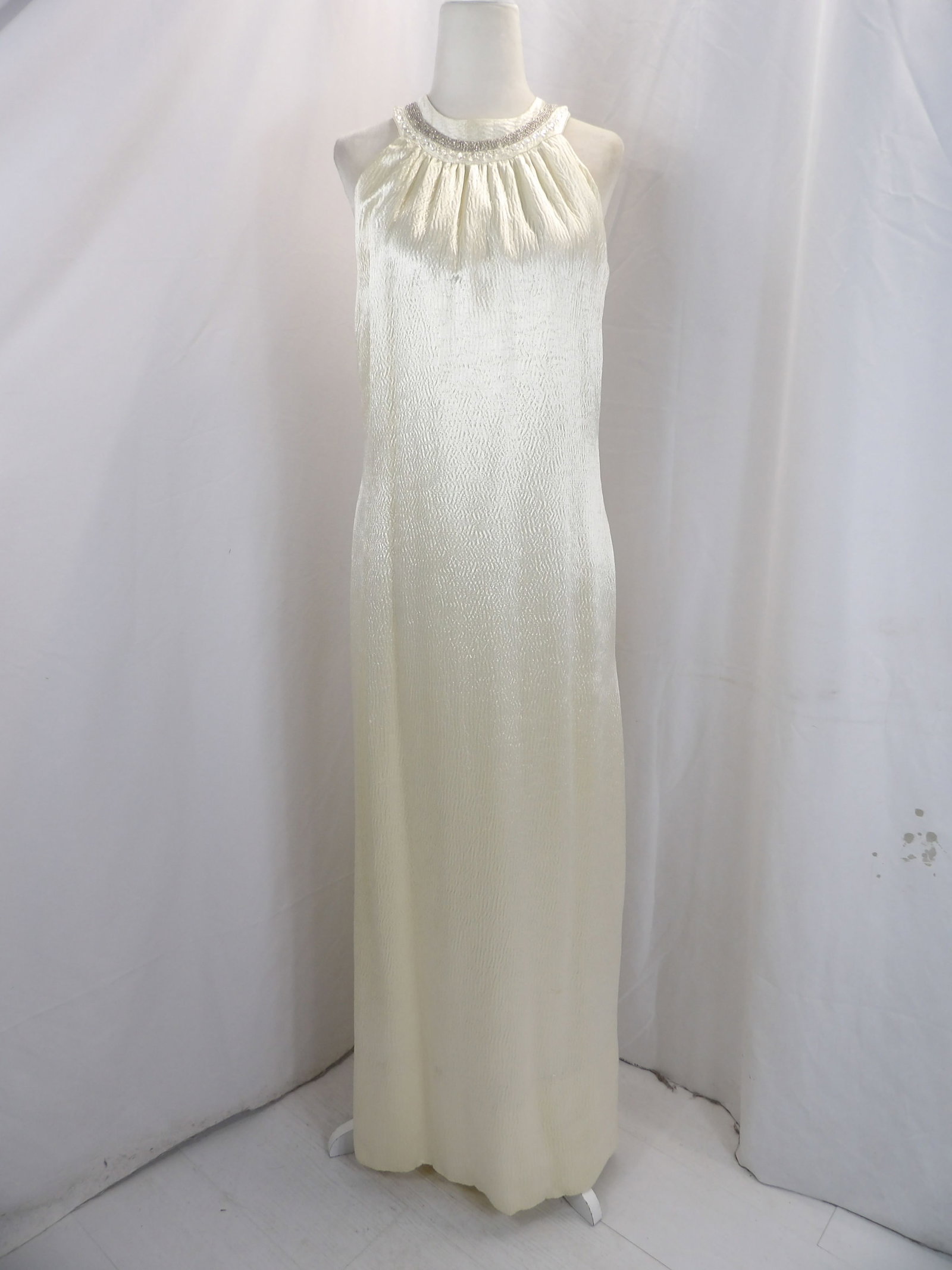 VINTAGE 1960'S WHITE PUCKERED SATIN GOWN WITH BEADING: APPROX. 36 BUST, 34 WAIST. HAS A FEW SCUFF MARKS, A COUPLE SMALL HOLES & STAIN ON BACK. SEE PHOTOS.