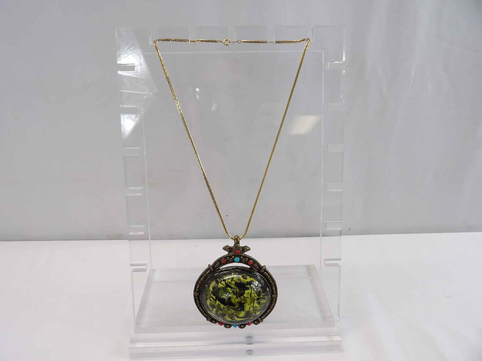 Extraordinary Large Vintage Green & Black Lucite Pendant with Chain: approx. 3 1/8 x 2 5/8 inch pendant