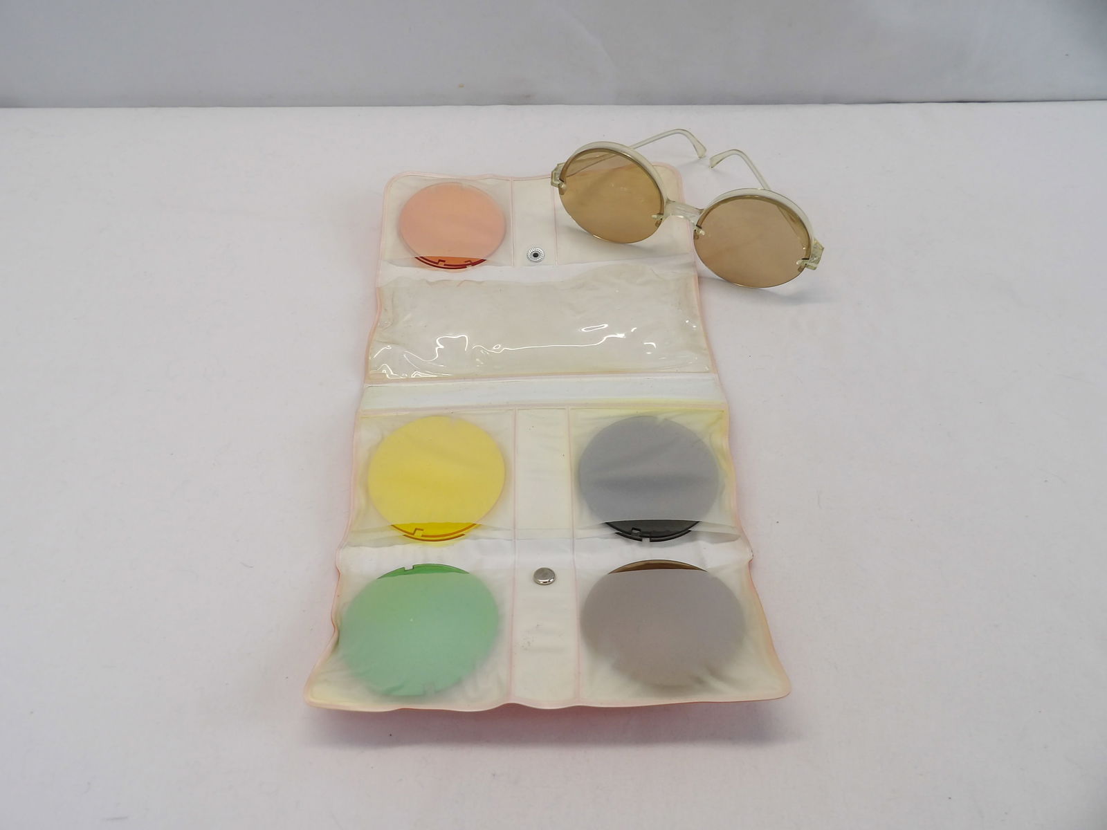 Vintage 1960's Sunglasses with 8 Pair of Colorful Changeable Lens: in original orange vinyl carrier, see photo's