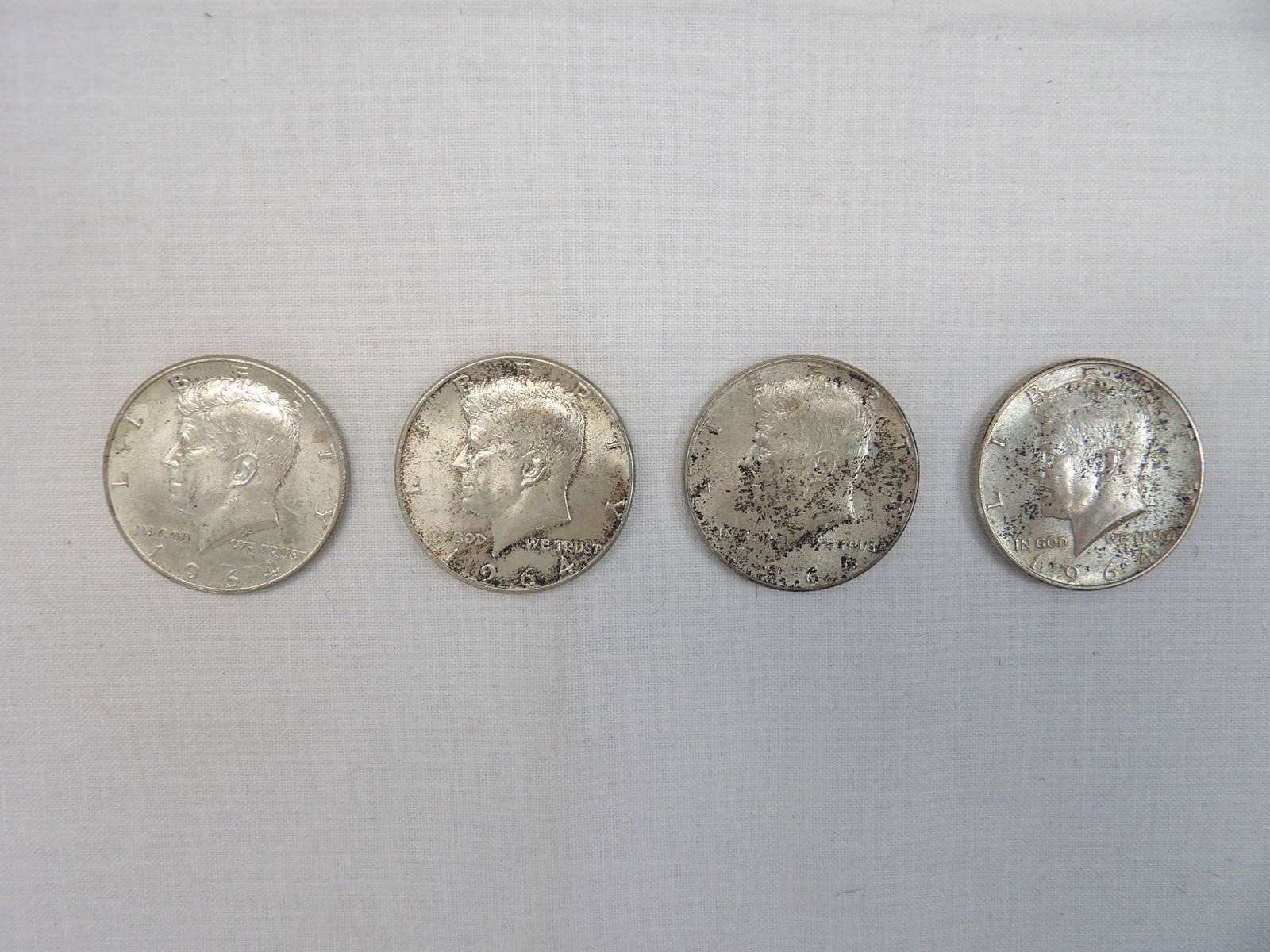 Lot of 4 Silver Kennedy Half's 1964: see photo's