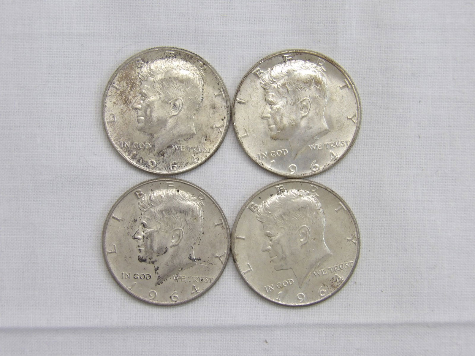 Lot of 4 Silver Kennedy Half's, 1964: see photo's