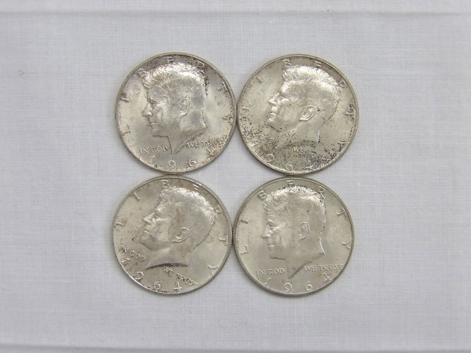 Lot of 4 Silver Kennedy Half's, 1964: see photo's