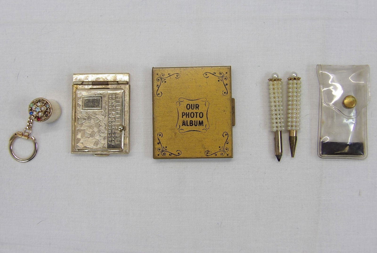 Lot of Vintage Purse Items, Phone Book, Photo Album, Miniature Pen Pencil Set, Key Chain with Dime (1 of 12)