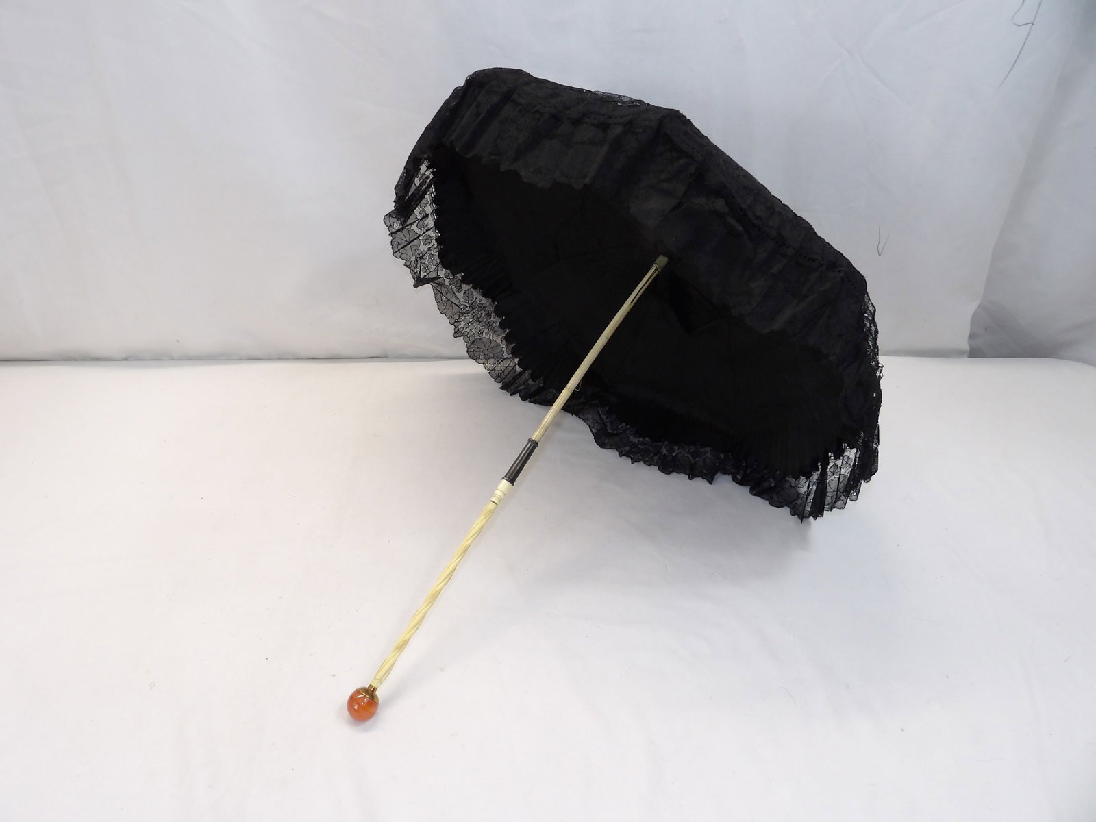 Antique Black French Lace Bebe Parasol with Bone Handle: some silk fray on lining, some damage to lace that is hard to find, see photo's